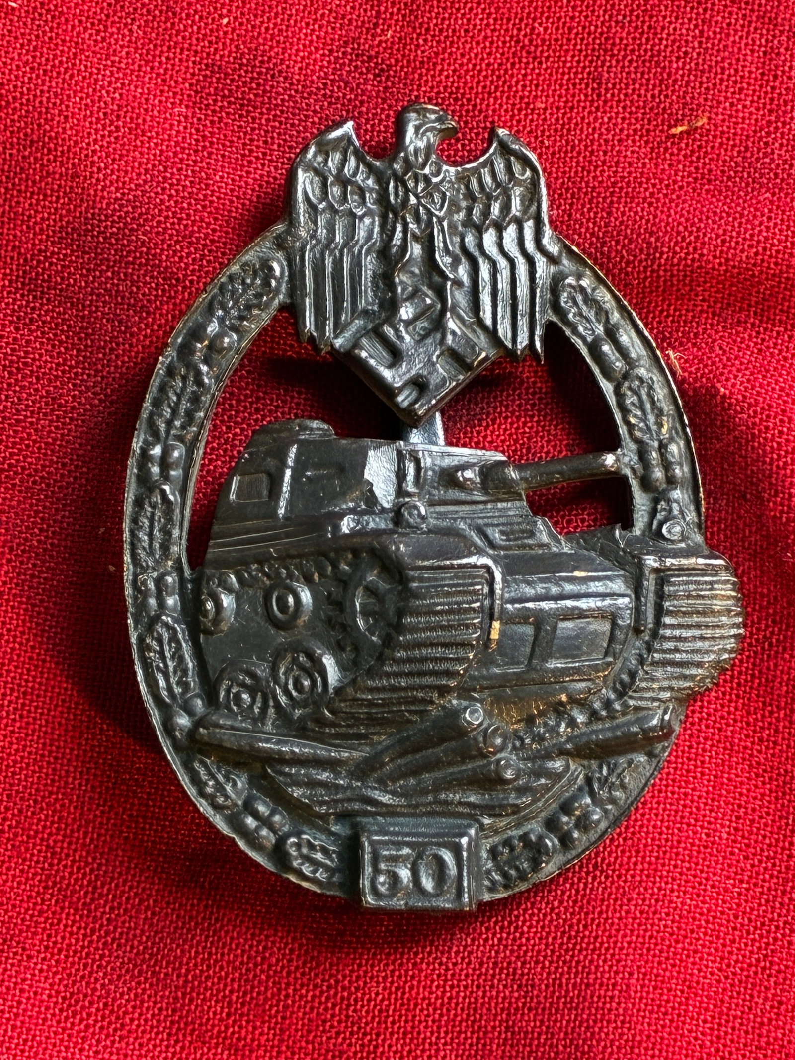 WW2 German Army / Waffen SS Special Grade 50 Engagements Panzer Assault Badge: WW2 German Army / Waffen SS Special Grade 50 Engagements Panzer Assault Badge. The badge is heavy, multi-piece, riveted construction. The brighter finish of the wreath and eagle is largely intact, as 