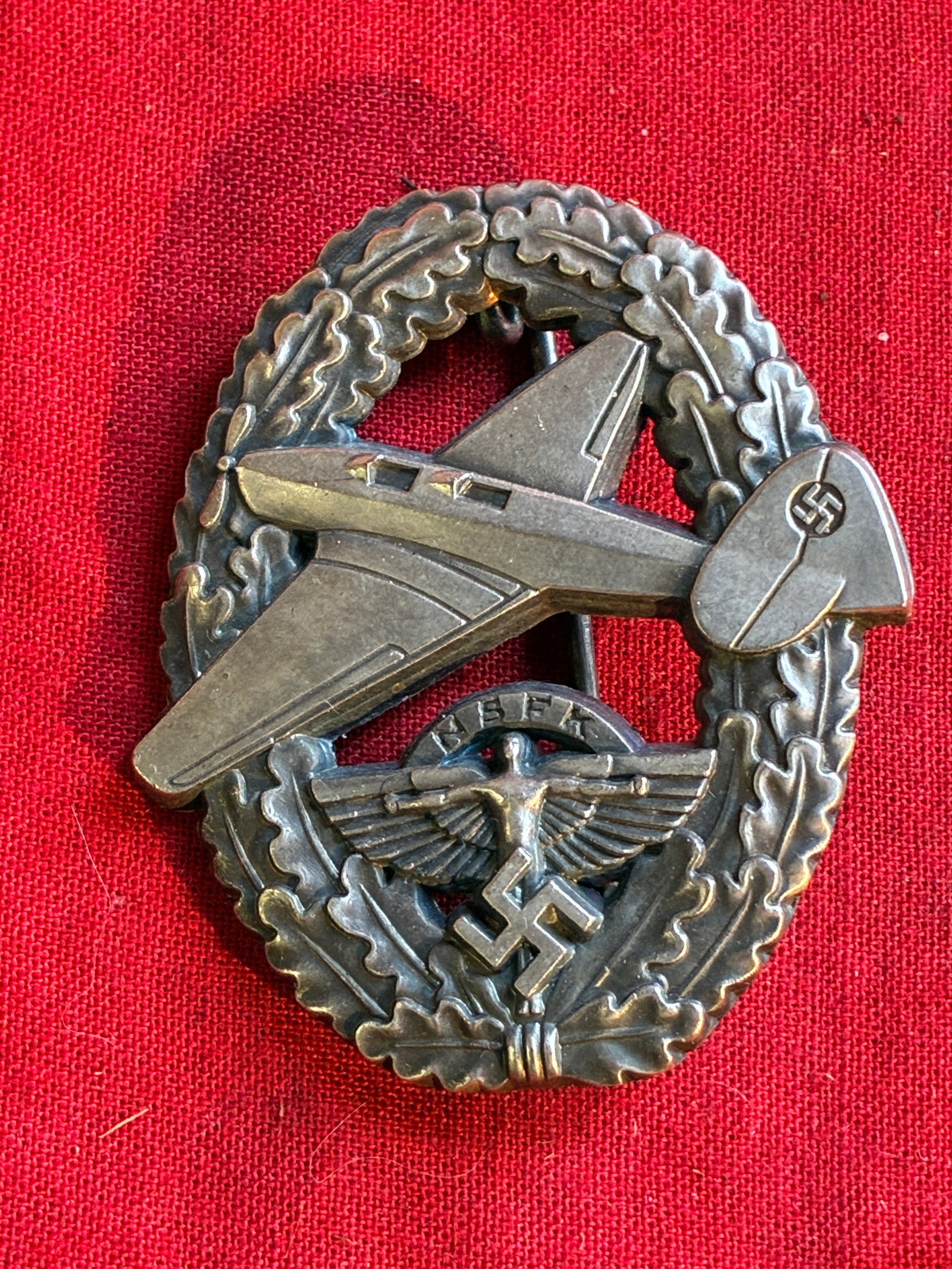 WWII German Pre Luftwaffe NSFK Glider Pilot Badge: WWII German Pre Luftwaffe NSFK Glider Pilot Badge. An ultra rare find that is in mint overall shape and condition with a beautiful overall patina. Shows good wear and use. Please view all detailed pic