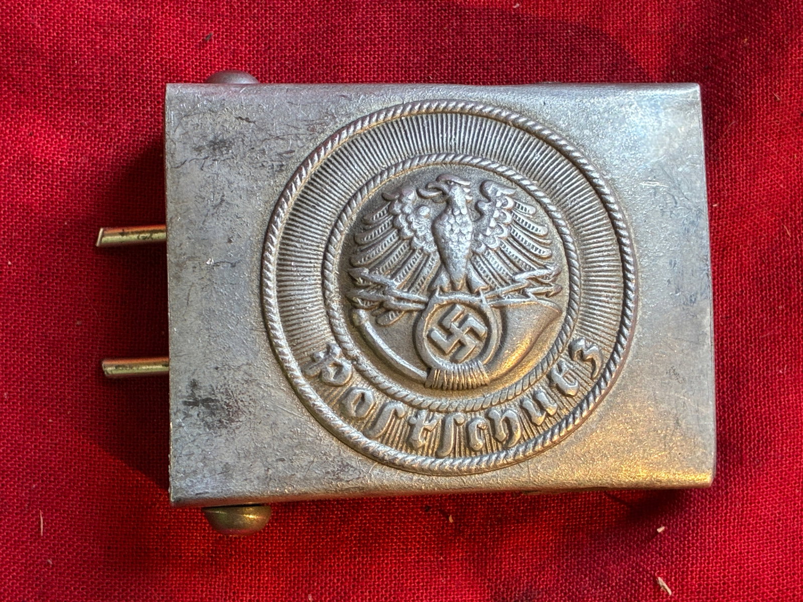 WWII German Postal Police Belt Buckle By RZM M34/2: WWII German Postal Police Belt Buckle By RZM M34/2. An ultra rare find that is in mint overall shape and condition with a beautiful overall patin. Shows good wear and use. Please view all detailed pic