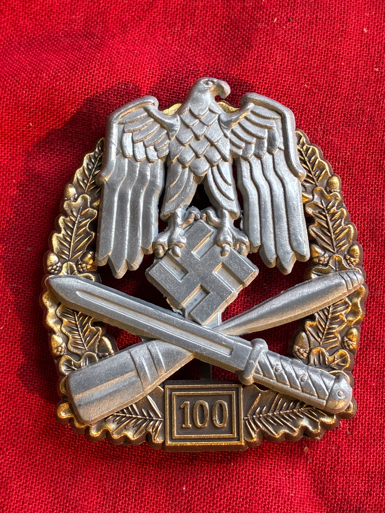 WWII GERMAN 100 ENGAGEMENTS GENERAL ASSAULT BADGE BY JFS: WWII GERMAN 100 ENGAGEMENTS GENERAL ASSAULT BADGE BY JFS. WWII German 100 General Assault badge. Obverse features Reichsadler above dagger and grenade riveted to an oak leaf wreath. Reverse marked JFS