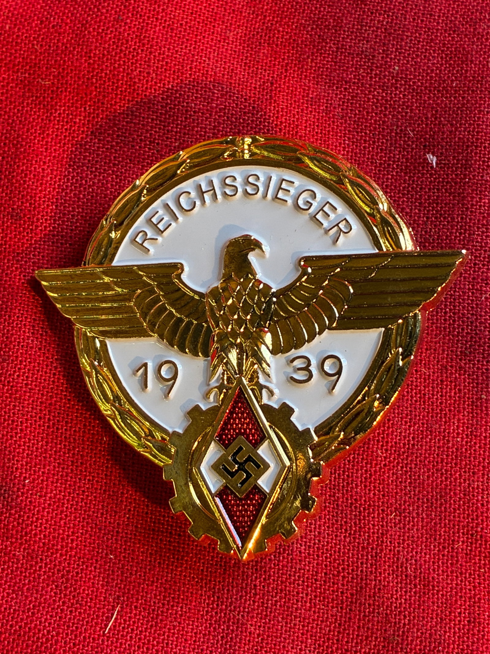 WWII GERMAN THIRD REICH REICHESSIEGER HITLER YOUTH BADGE BY G. BREHMER MARKNEUKIRCHEN: WWII GERMAN THIRD REICH REICHESSIEGER HITLER YOUTH BADGE BY G. BREHMER MARKNEUKIRCHEN. IN EXCEPTIONAL OVERALL SHAPE AND CONDITION WITH A BEAUTIFUL OVERALL PATINA. PLEASE VIEW ALL DETAILED PICTURES. A 