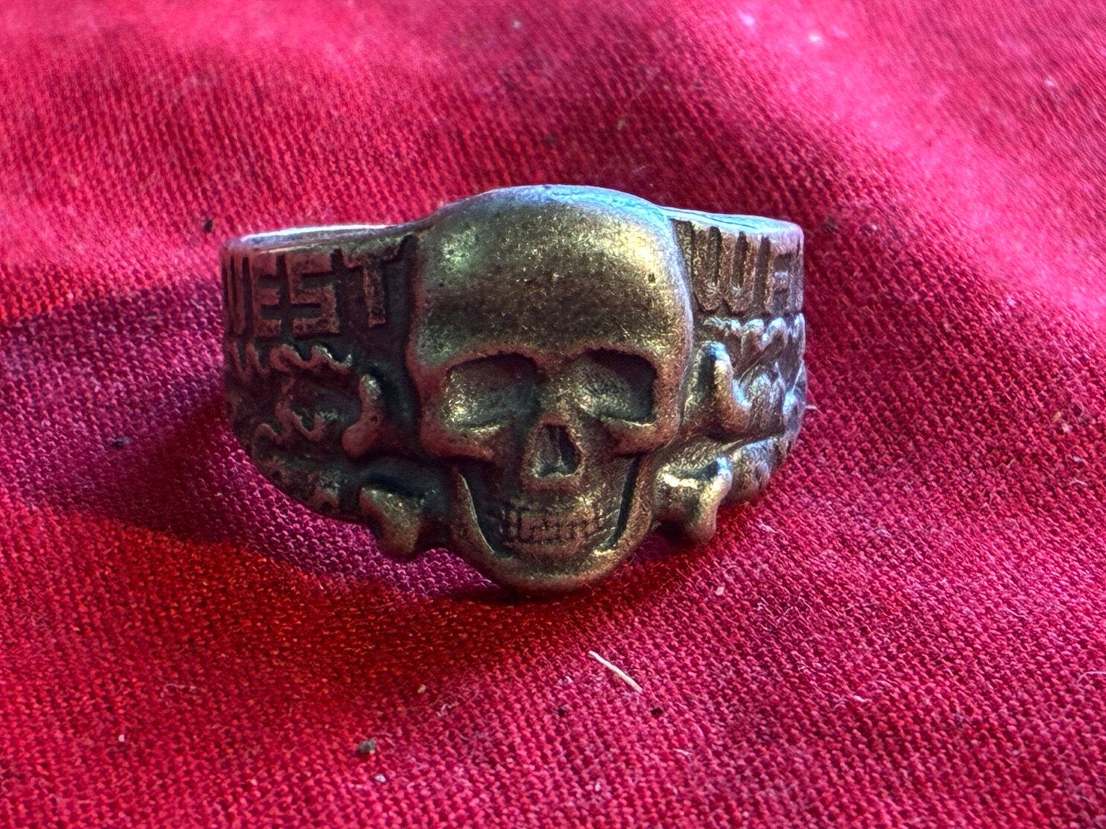 WWII THIRD REICH GERMAN WEST WALL TOTENKOPF RING IN SILVER: WWII THIRD REICH GERMAN WEST WALL TOTENKOPF RING IN SILVER. A RARE FIND. SHOWS GOOD WEAR AND USE WITH A BEAUTIFUL OVERALL PATINA. PLEASE VIEW ALL DETAILED PICTURES. A SCARCE EXAMPLE OF THE TIME PERIOD