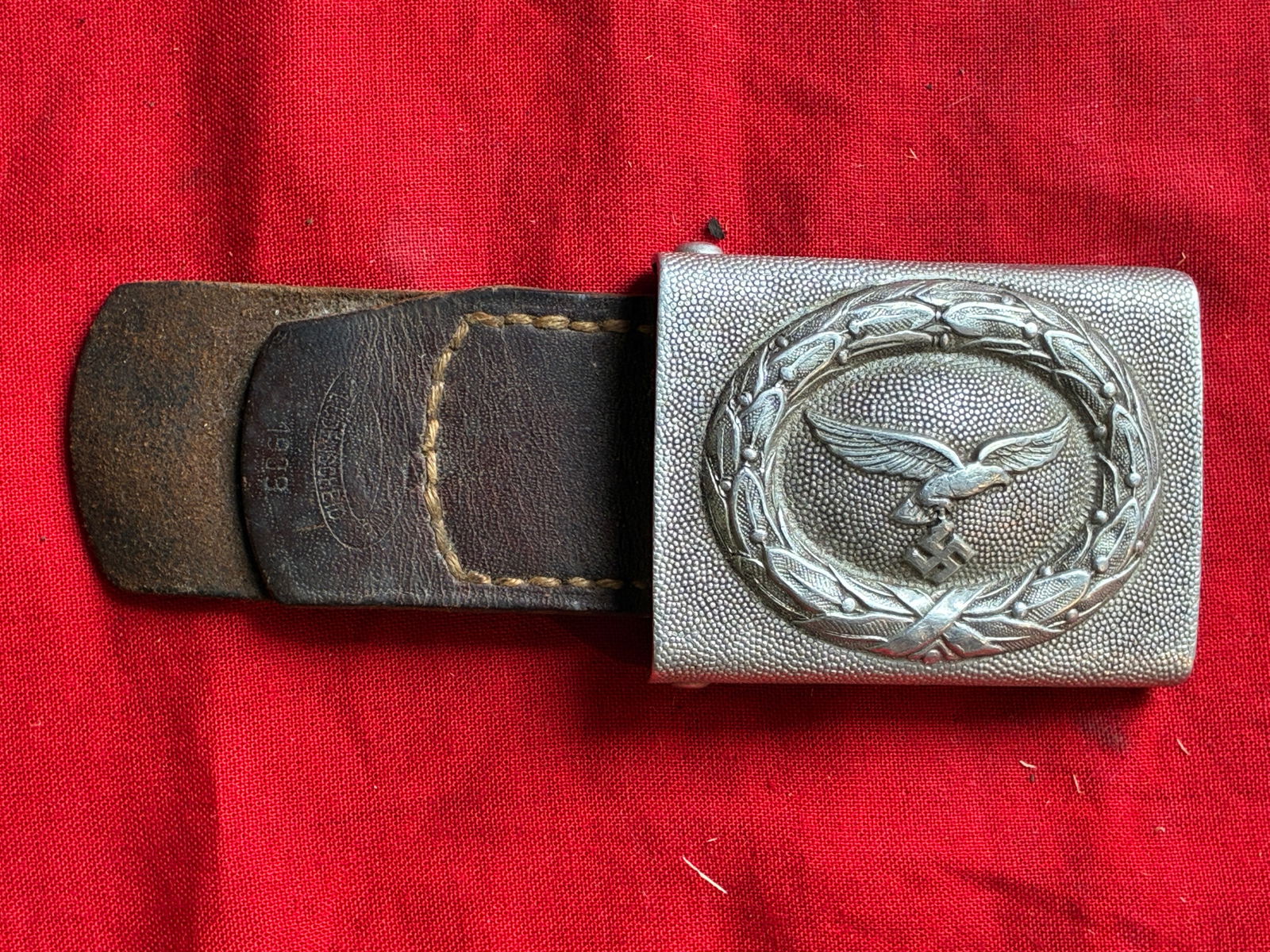 Early WW2 German Luftwaffe belt buckle in aluminum 1939 Maker Marked E.Schneider, Lüdenscheid: Early WW2 German Luftwaffe belt buckle in aluminum 1939 Maker Marked E.Schneider, Lüdenscheid. An ultra rare find. Shows good wear and use with a beautiful overall patina. Please view all detailed pi