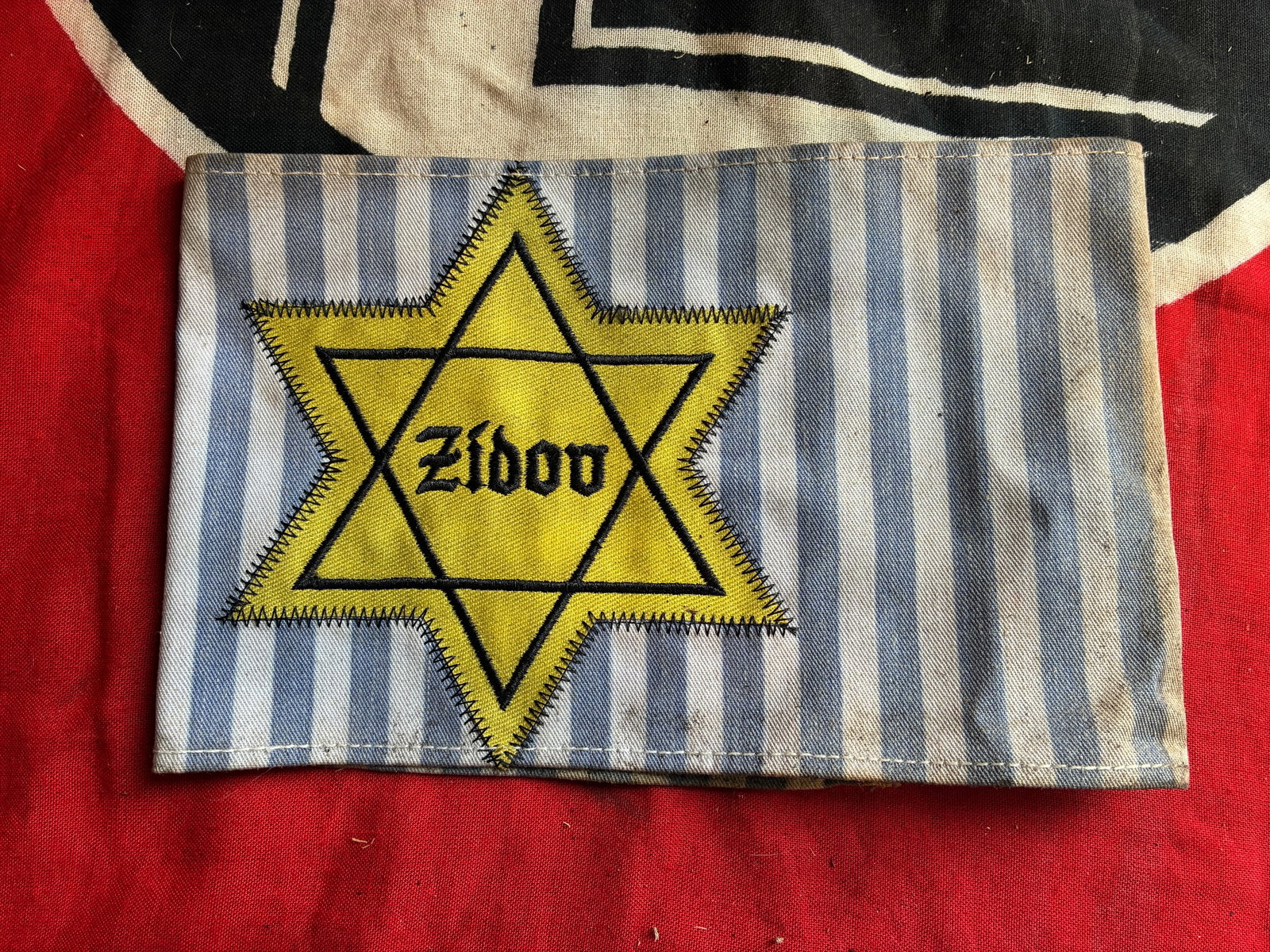 RARE WW2 GERMAN YUGOSLAVIAN ZIDOV STAR OF DAVID CONCENTRATION CAMP ARMBAND: RARE WW2 GERMAN YUGOSLAVIAN ZIDOV STAR OF DAVID CONCENTRATION CAMP ARMBAND. A VERY RARE FIND. SHOWS GOOD WEAR AND USE WITH A BEAUTIFUL OVERALL PATINA. PLEASE VIEW ALL DETAILED PICTURES. A SCARCE EXAMP