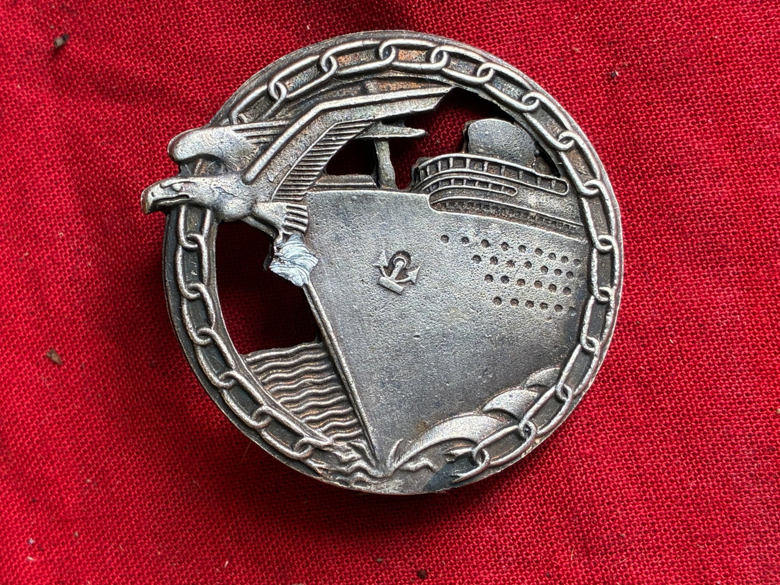 WW2 German Kriegsmarine Blockade runner badge by Schwerin: WW2 German Kriegsmarine Blockade runner badge by Schwerin. Kriegsmarine Blockade runner badge by Schwerin, Berlin. Tombak construction with soldered on set up. Maker marked on the reverse. Large badge