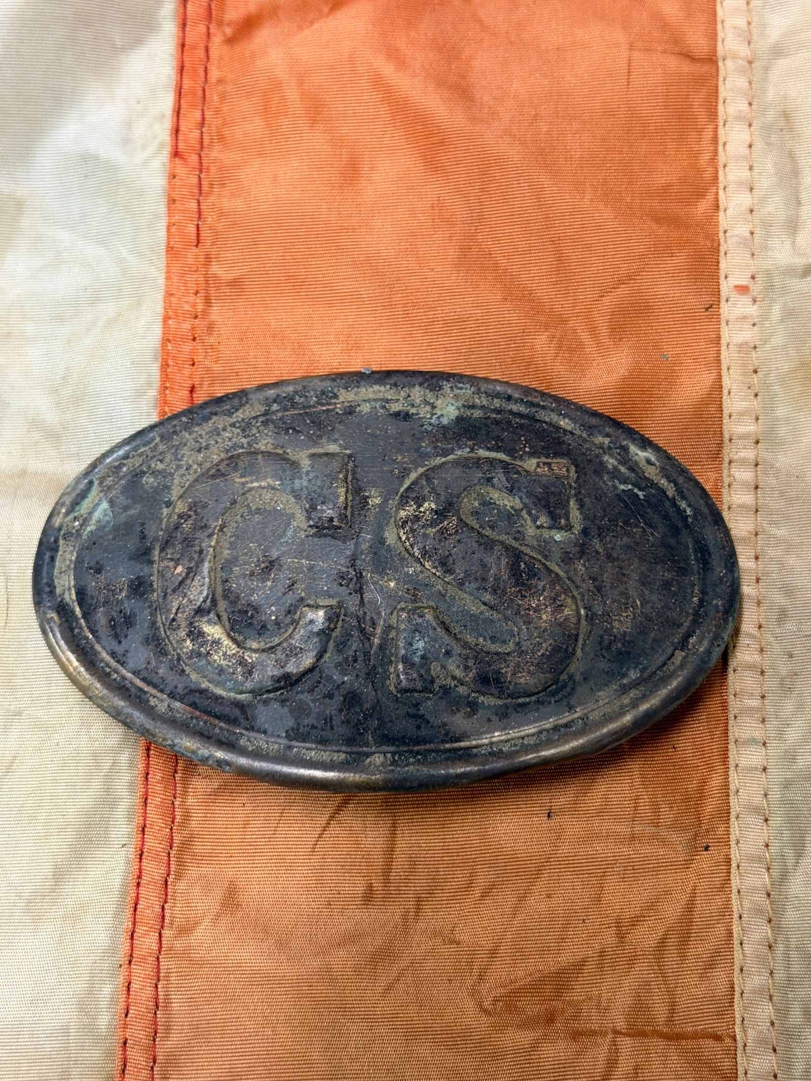 CIVIL WAR CONFEDERATE CSA CS OVAL BELT BUCKLE FROM PETERSBURG, VA: CIVIL WAR CONFEDERATE CSA CS OVAL BELT BUCKLE FROM PETERSBURG, VA. A RARE FIND. SHOWS GOOD WEAR AND USE WITH A BEAUTIFUL OVERALL PATINA. HAS A GREAT LOOK TO IT WITH AN EXCELLENT OVERALL EYE APPEAL. A