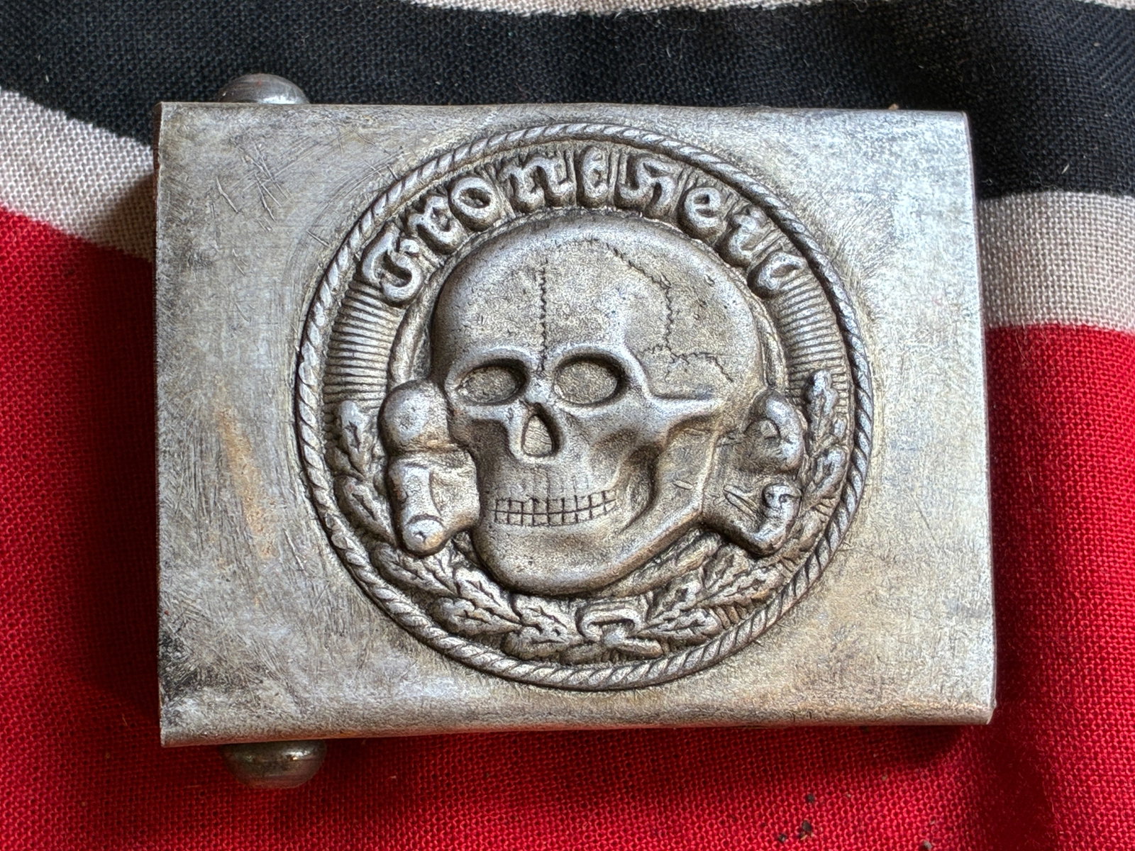 WW2 GERMAN TOTENKOPF SS DEATH SKULL BELT BUCKLE BY RZM M34/2: WW2 GERMAN TOTENKOPF SS DEATH SKULL BELT BUCKLE BY RZM M34/2. GERMAN DEATH HEAD "FRONT HEIL" BELT BUCKLE, WWII, DEUTSCHES TOTENKOPF "FRONT HEIL" KOPPELSCHLOSS , WWII R.Z.M. M34/2 REICHSZEUGMEISTEREI S