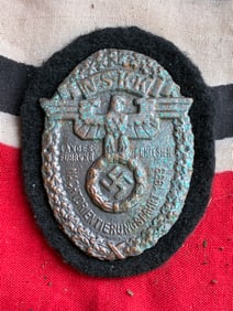 RARE WW2 GERMAN NSKK ALUMINUM BADGE OF BLACK FELT BACKING