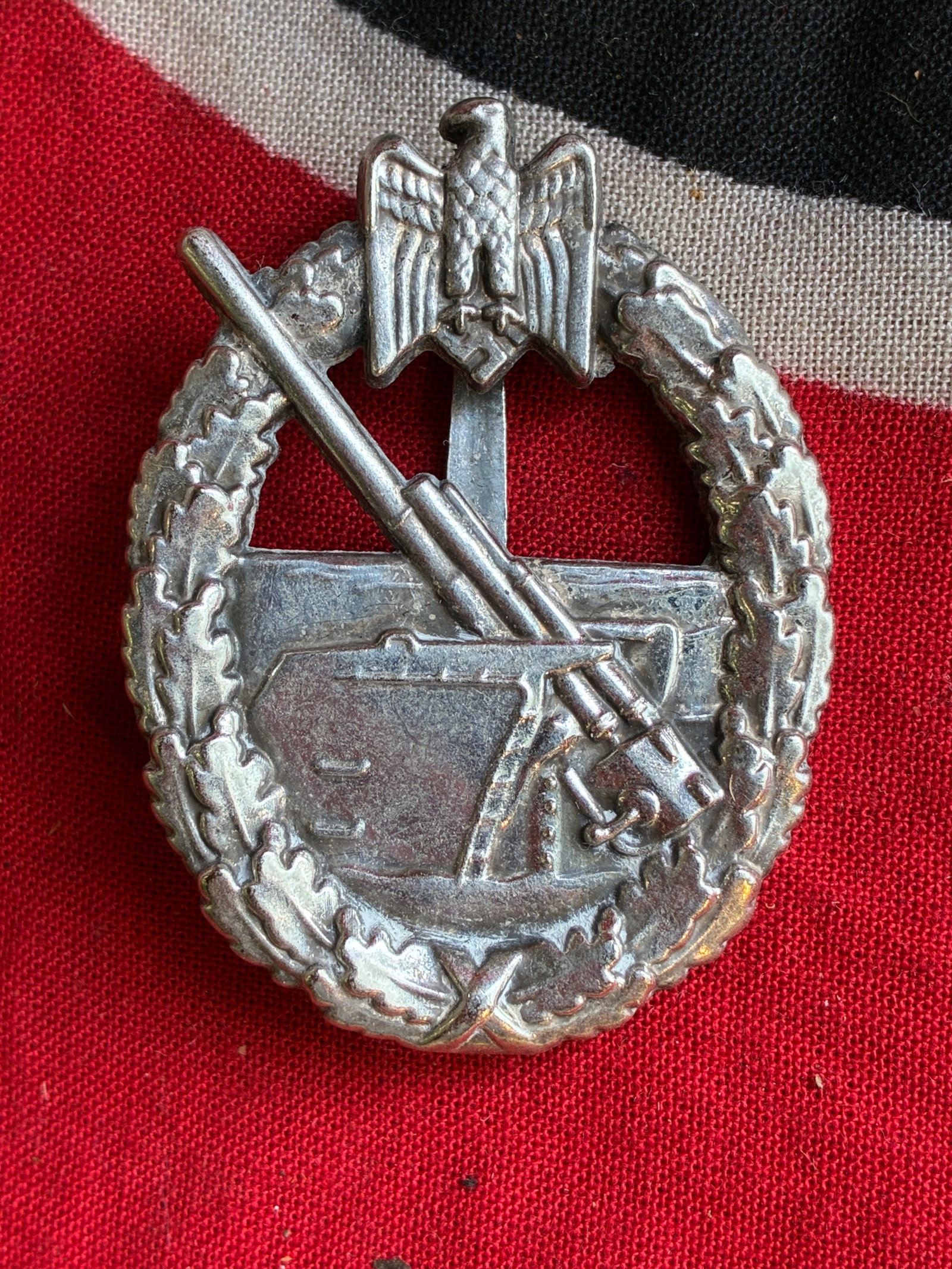 WW2 German Kriegsmarine Coatal Artillery Badge By Schwerin: WW2 German Kriegsmarine Coatal Artillery Badge By Schwerin. Contructed in tombak mid to late war which retains a nice finish. The reverse of the decoration is clearly marked with ‘Schwerin Berlin’