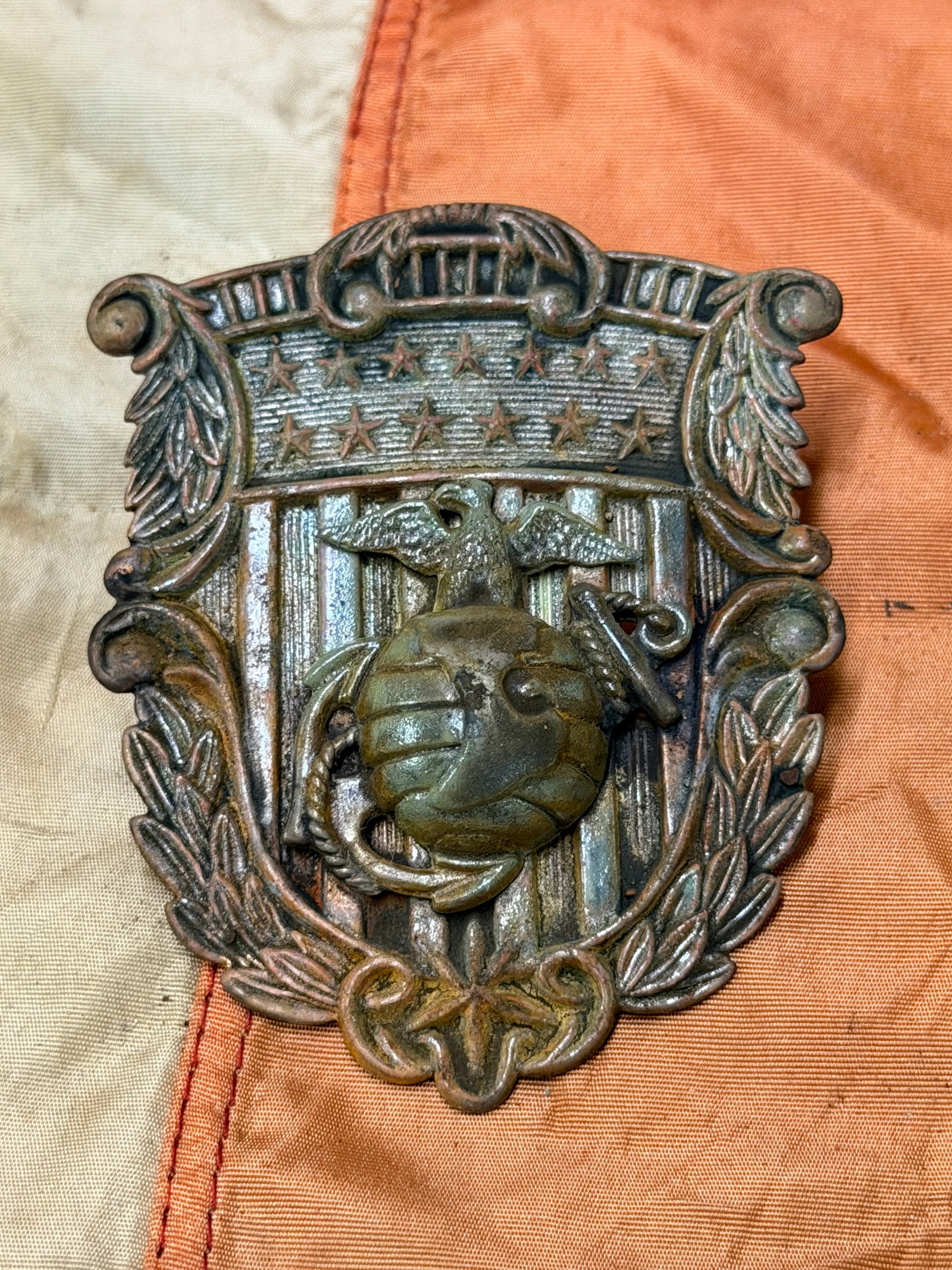 Indian Wars US Marine Corps Model 1875 Dress Hat Insignia: Indian Wars US Marine Corps Model 1875 Dress Hat Insignia. An ultra rare find that is in mint overall shape and condition with a beautiful overall patina. Still has the fastening hooks attached to the