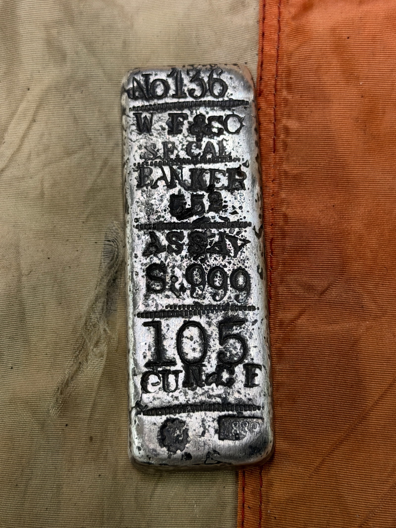 1889 WELLS FARGO 10.5 OZT .999 PURE SILVER INGOT SILVER BAR NO. 136: 1889 WELLS FARGO 10.5 OZT .999 PURE SILVER INGOT SILVER BAR NO. 136. AN ULTRA RARE FIND THAT IS IN MINT OVERALL SHAPE AND CONDITION WITH A BEAUTIFUL OVERALL PATINA. HAS A GREAT LOOK TO IT WITH AN EXCE