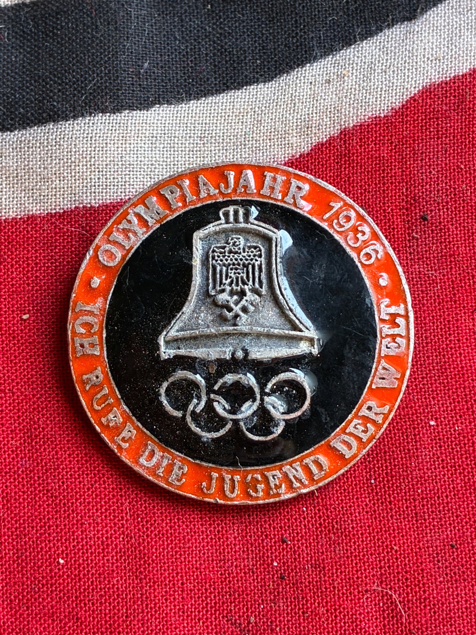 1936 WW2 German Berlin olympics bell red/black enamel badge Marked WOA/53: 1936 WW2 German Berlin olympics bell red/black enamel badge Marked WOA/53. An ultra rare find that is in mint overall shape and condition with a beautiful overall patina. Beautifully enameled with no 