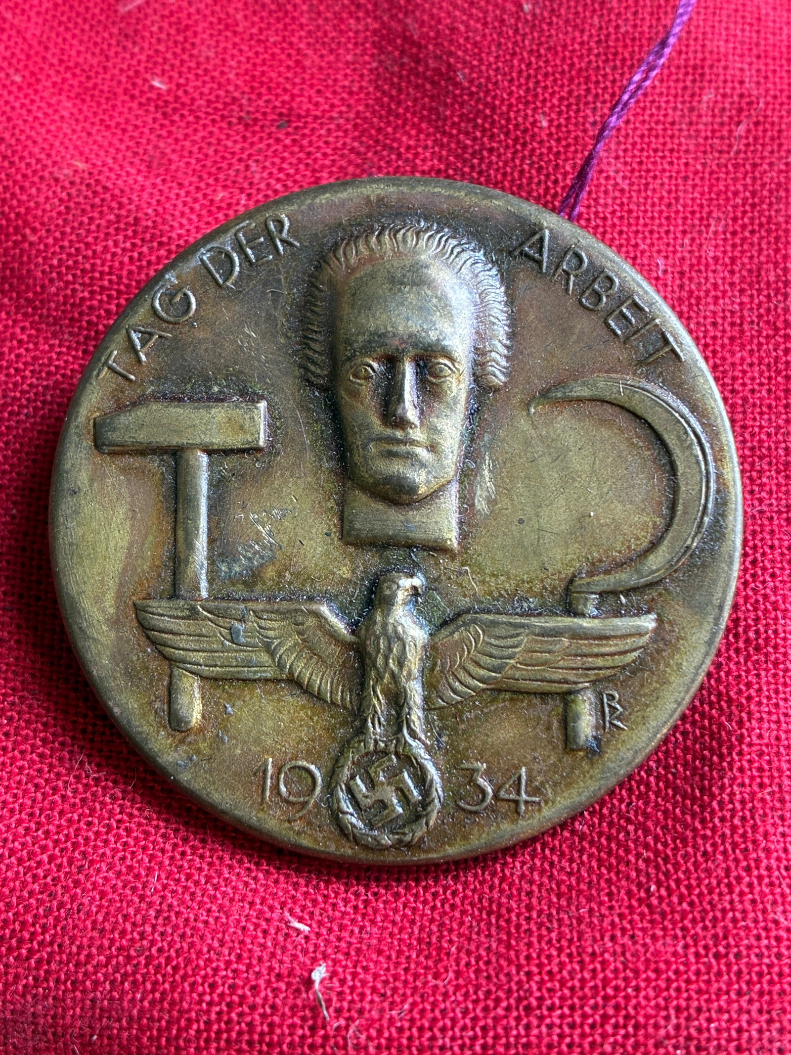 WW2 German 1934 Tag Der Arbeit Tinnie-Lüdenscheid.: WW2 German 1934 Tag Der Arbeit Tinnie-Lüdenscheid. 1934 German “Tag der Arbeit” (Day of Labor) tinnie, issued for the National Socialist celebration of Labor Day on May 1st, 1934. Crafted fro