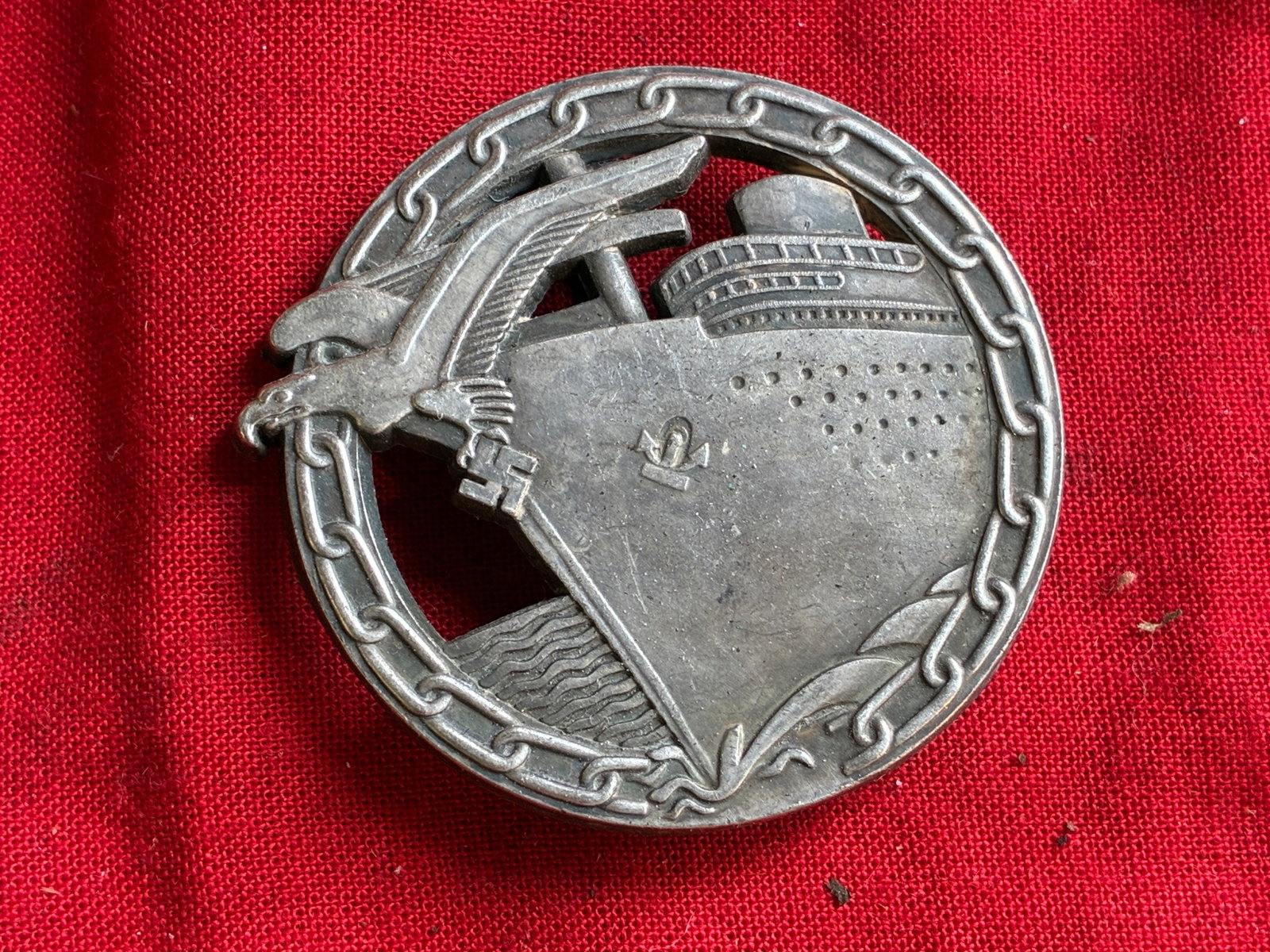 WW2 German Kriegsmarine Blockade runner badge by Schwerin Berlin: WW2 German Kriegsmarine Blockade runner badge by Schwerin Berlin. Kriegsmarine Blockade runner badge by Schwerin, Berlin. Tombak construction with soldered on set up. Maker marked on the reverse. Larg