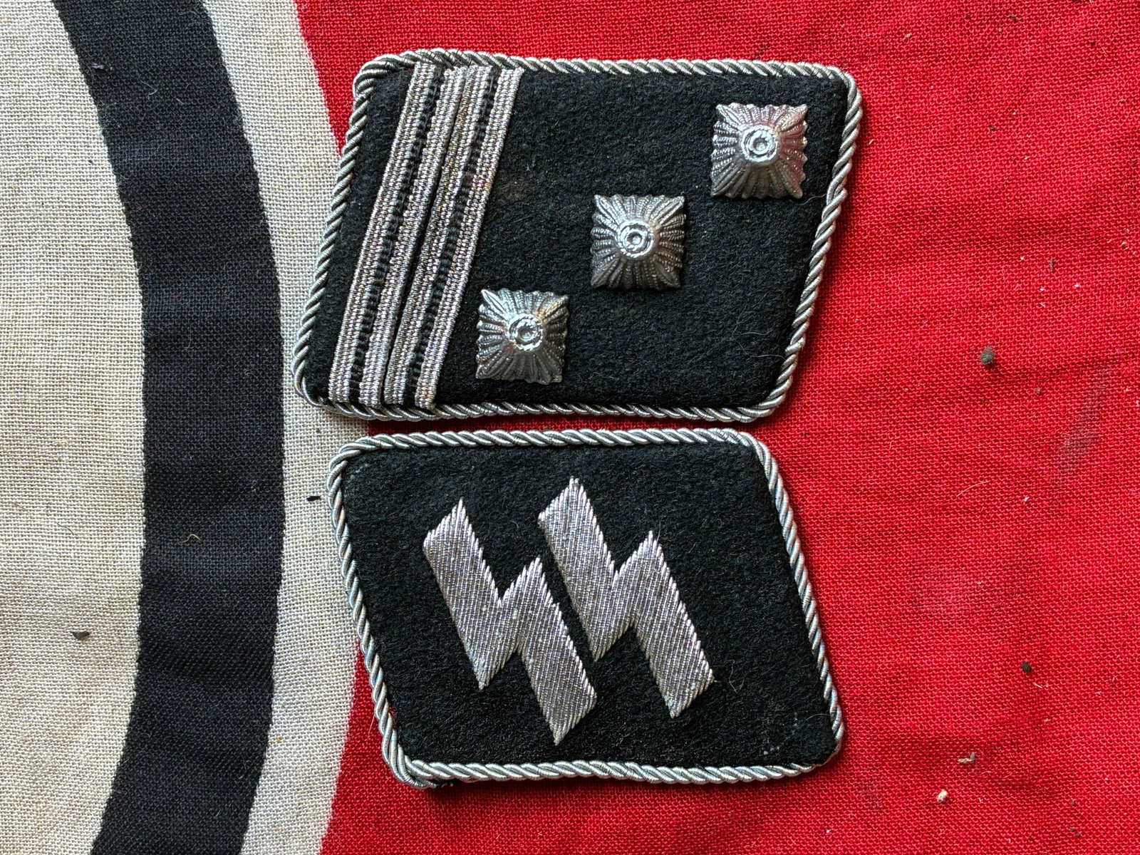 WW2 German Waffen-SS Collar Tabs SS-Obersturmbannführer TO SS-Mann With RZM Paper Tag: WW2 German Waffen-SS Collar Tabs SS-Obersturmbannführer TO SS-Mann With RZM Paper Tag. A rare find. Shows good wear and use with a beautiful overall patina. Please view all detailed pictures. A rare 