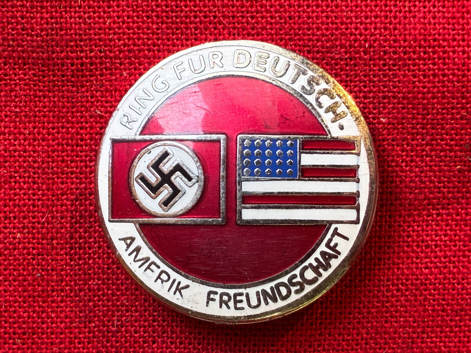 GERMAN WWII THIRD REICH GERMAN AMERICAN BUND BADGE BY RZM m1/129: WWII Third Reich German American Bund membership badge pin. Measures about 1 inch in diameter. Reverse is maker marked RZM M1/129.