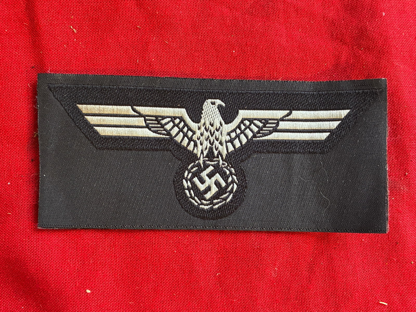 WWII German M39 Black Panzer Breast Eagle: WWII German M39 Black Panzer Breast Eagle. German Army Panzer versions of the breast eagle on a black base to match the black panzer wrap uniform. , Later M39 pattern, machine woven national breast ea