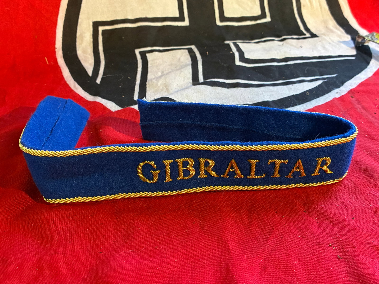 WW2 GERMAN GIBRALTAR EMBROIDERED TUNIC CUFF TITLE: WW2 GERMAN GIBRALTAR EMBROIDERED TUNIC CUFF TITLE. A RARE FIND. SHOWS GOOD WEAR AND USE WITH A BEAUTIFUL OVERALL PATINA. PLEASE VIEW ALL DETAILED PICTURES. A RARE EXAMPLE.