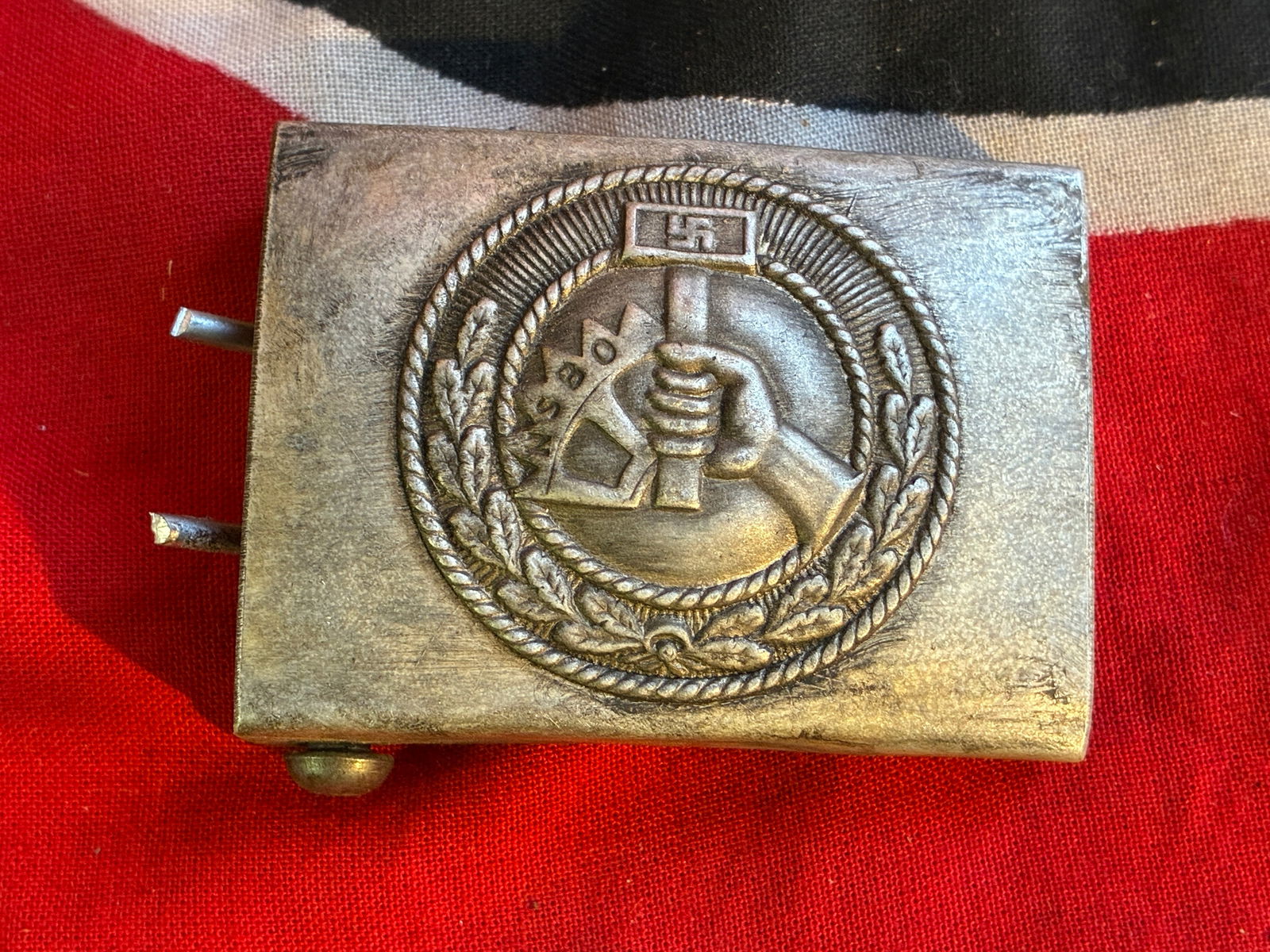 RARE WW2 GERMAN NSBO LABOR CORPS BELT BUCKLE BY RZM M34/2: RARE WW2 GERMAN NSBO LABOR CORPS BELT BUCKLE BY RZM M34/2. A RARE FIND. SHOWS GOOD WEAR AND USE WITH A BEAUTIFUL OVERALL PATINA. PLEASE VIEW ALL DETAILED PICTURES. A RARE EXAMPLE OF THE TIME PERIOD.
