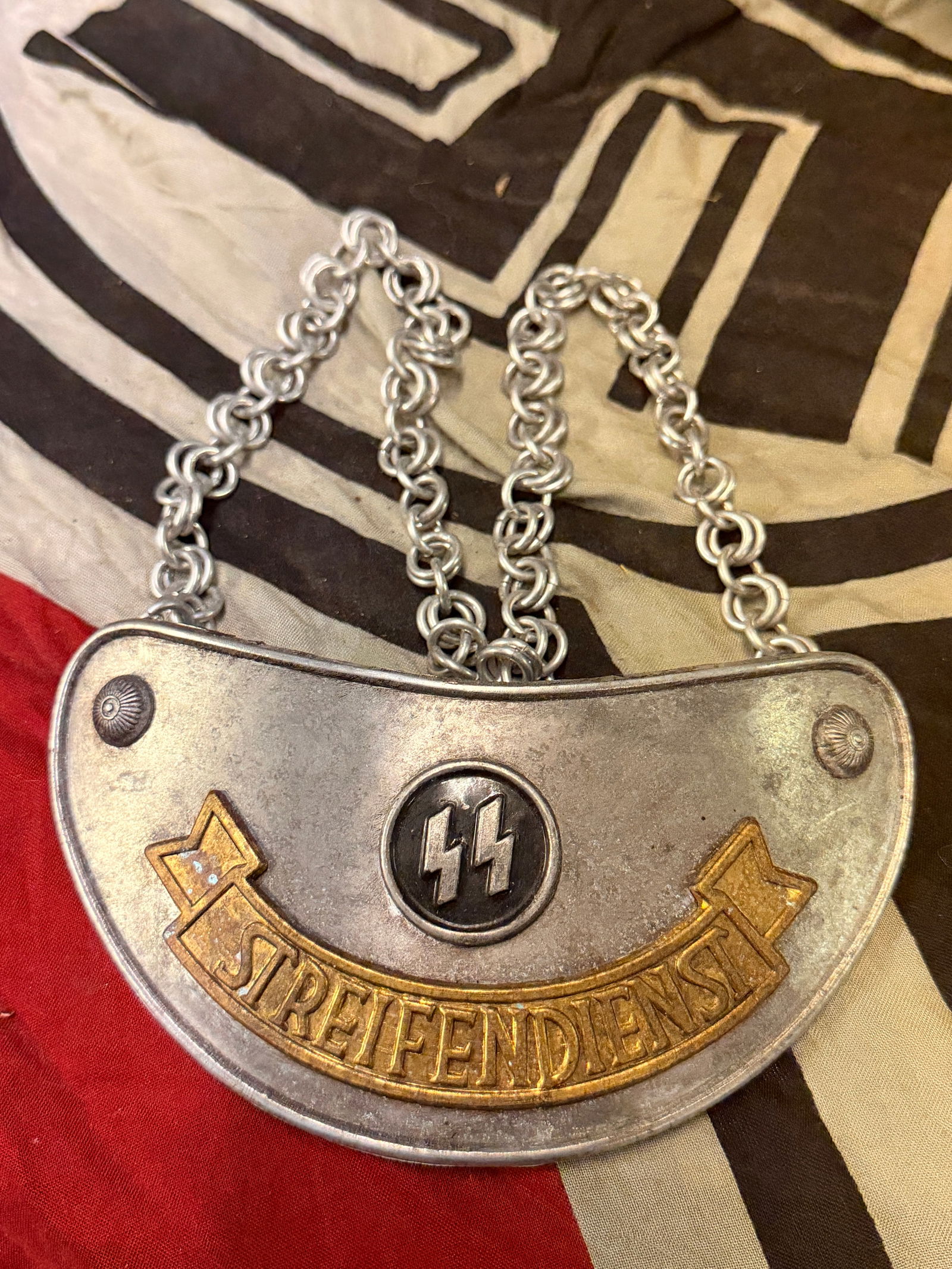 German World War II SS Parade plated gorget: German World War II SS Parade plated gorget. Shows good wear and use with a beautiful overall paitna. Please view all detailed pictures. A rare example of the time period.