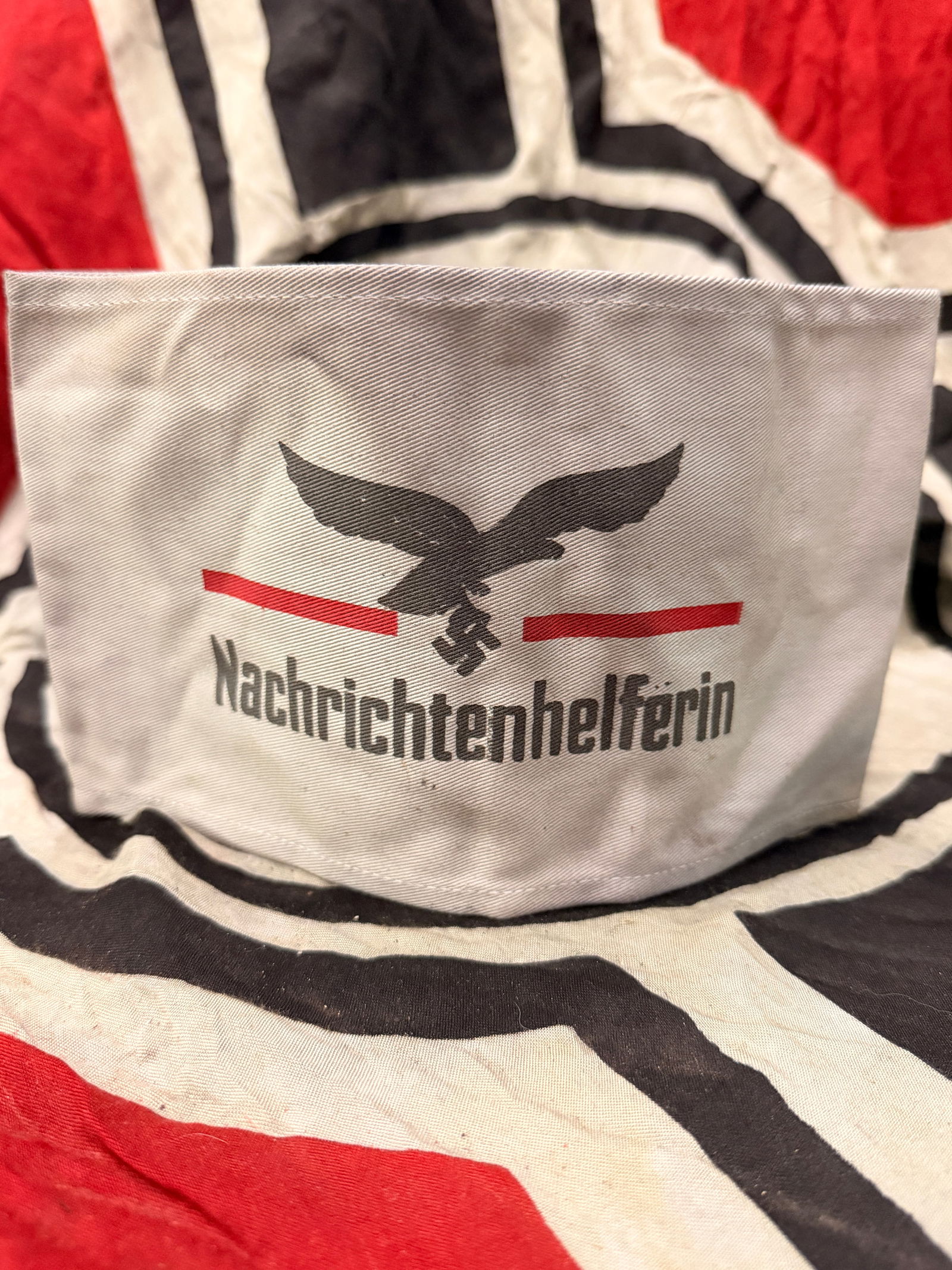 WW2 GERMAN NACHRICHTENHELFERIN LUFTWAFFE ARMBAND WITH RZM PAPER TAG: WW2 GERMAN NACHRICHTENHELFERIN LUFTWAFFE ARMBAND WITH RZM PAPER TAG. A VERY RARE FIND. SHOWS GOOD WEAR AND USE WITH A BEAUTIFUL OVERALL PATINA. THIS WAS WORN BY SIGNAL-COMMUNICATION WOMAN AUXILIARY UN