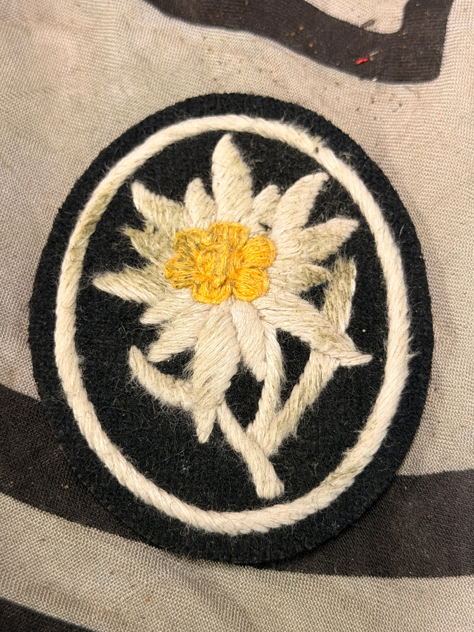 WW2 German Elite Hand sewn Edelweiss mountain climber patch: WW2 German Elite Hand sewn Edelweiss mountain climber patch. A RARE EXAMPLE. SHOWS GOOD WEAR AND USE WITH A BEAUTIFUL OVERALL PATINA. PLEASE VIEW ALL DETAILED PICTURES. A RARE EXAMPLE OF THE TIME PERI
