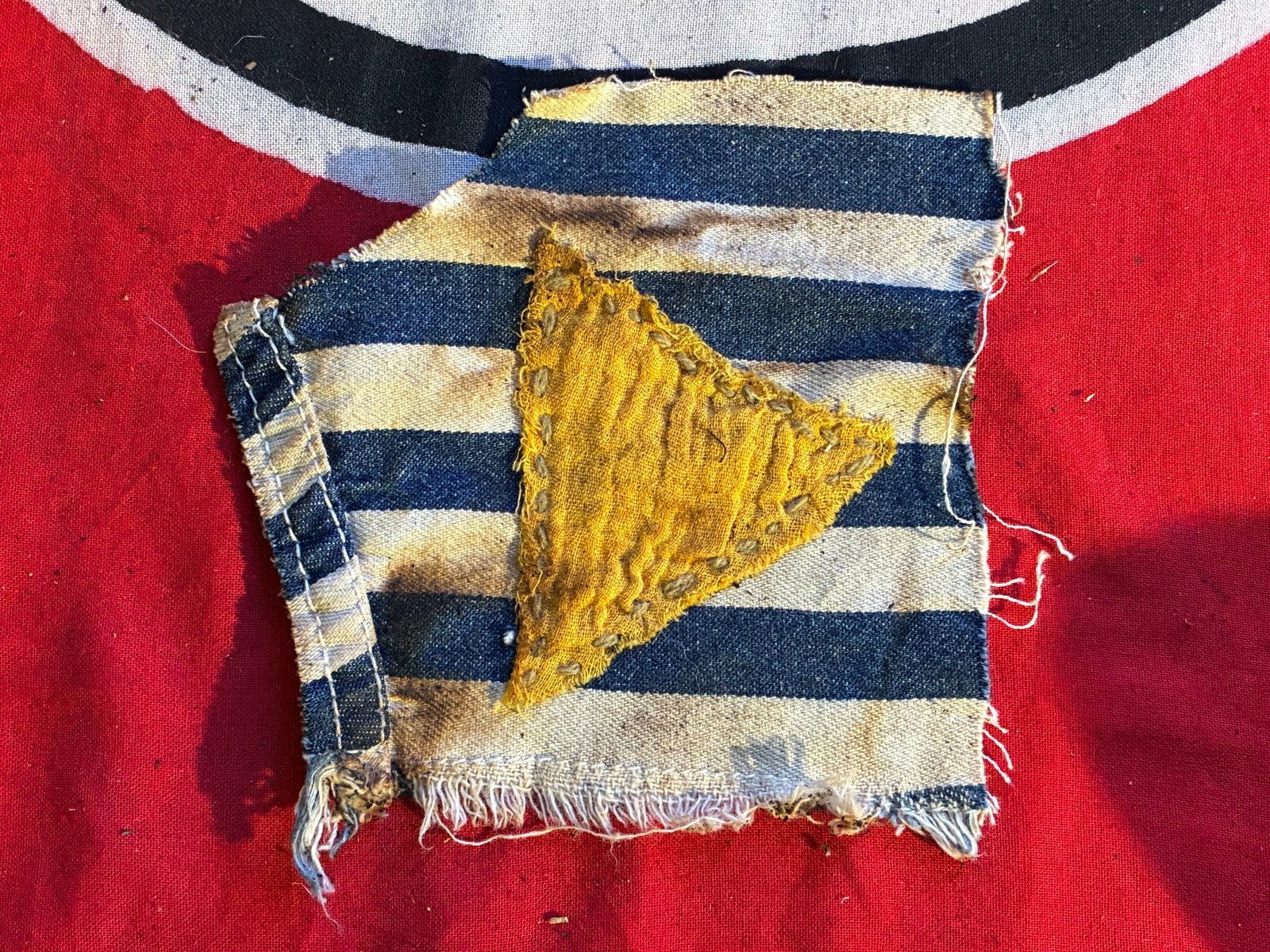 WW2 GERMAN REICH DEATH CAMP HOMOSEXUAL UNIFORM CUT OUT: WW2 GERMAN REICH DEATH CAMP HOMOSEXUAL UNIFORM CUT OUT. A VERY RARE FIND. PERIOD PATINA. CUT OUT OF A UNIFORM. PLEASE VIEW ALL DETAILED PICTURES.