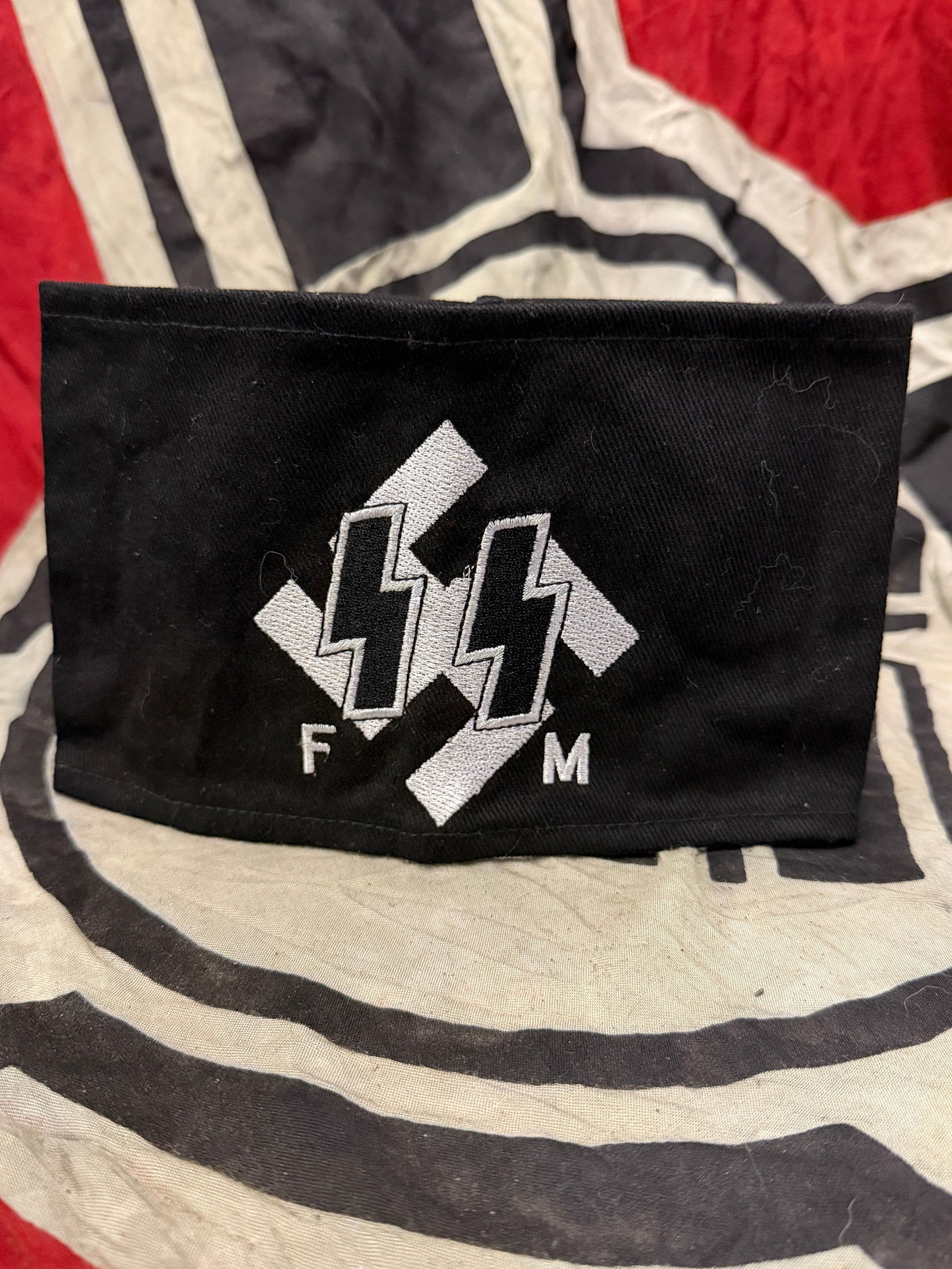 WW2 GERMAN WAFFEN SS FM ARMBAND WITH RZM SS PAPER TAG: WW2 GERMAN WAFFEN SS FM ARMBAND WITH RZM SS PAPER TAG. A VERY RARE EARLY EXAMPLE THAT IS IN MINT OVERALL SHAPE AND CONDITION WITH A BEAUTIFUL OVERALL PATINA. PLEASE VIEW ALL DETAILED PICTURES. A VERY