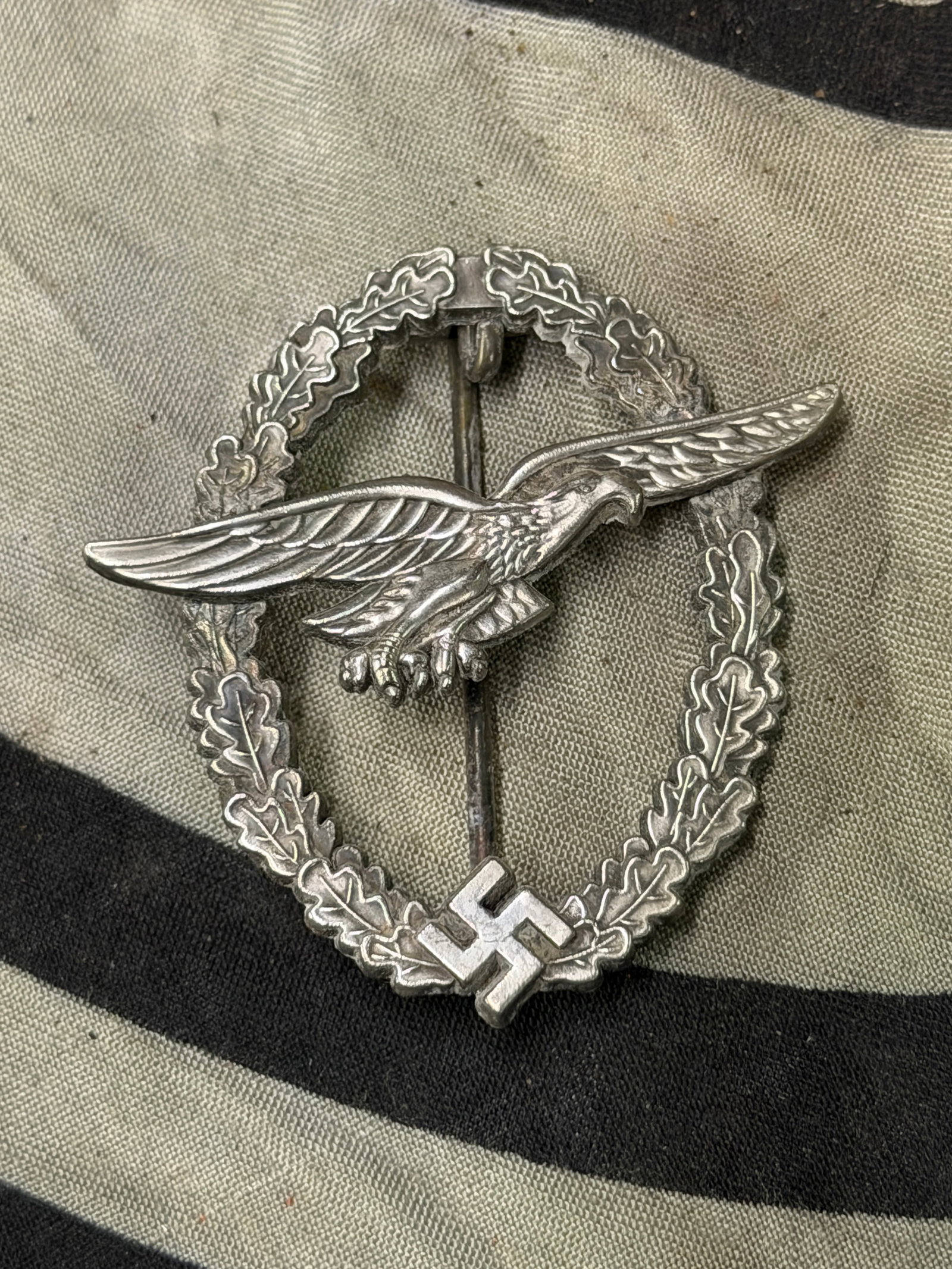 Rare WW2 German Luftwaffe Glider Pilot badge, 1940; early quality by C.E. Junker in Berlin: Rare German Luftwaffe Glider Pilot badge, 1940; early quality by C.E. Junker in Berlin; anodized silver eagle sub-contracted to BSW Bruder Schneider in Vienna; black flying eagle in center of medal di