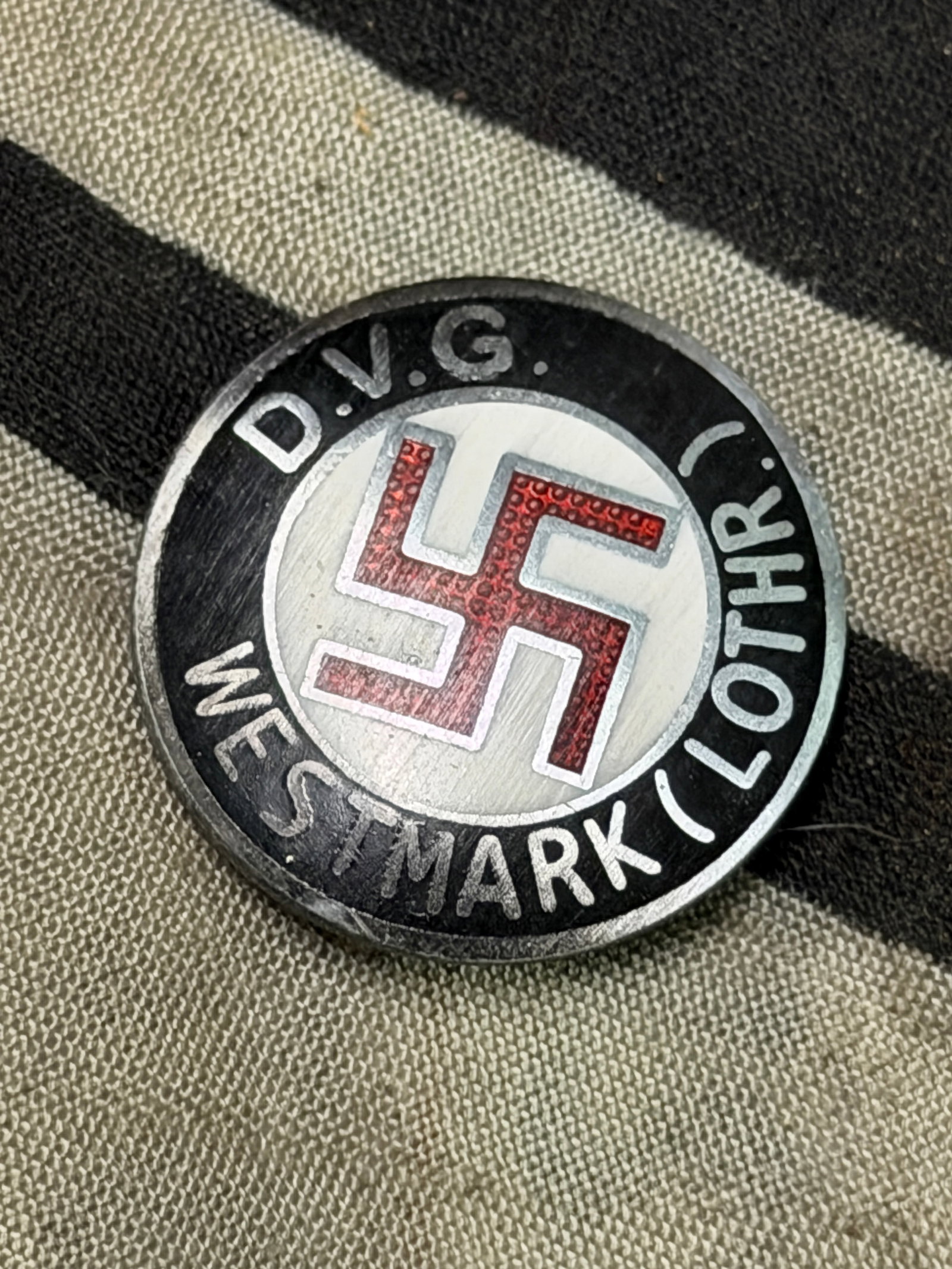 WW2 German Third Reich D.V.G. Westmark NSDAP Membership Enameled Pin Badge By W. Redo: WW2 German Third Reich D.V.G. Westmark NSDAP Membership Enameled Pin Badge By W. Redo. A very rare find. Shows good wear and use with a beautiful overall patina. Please view all detailed pictures. A r