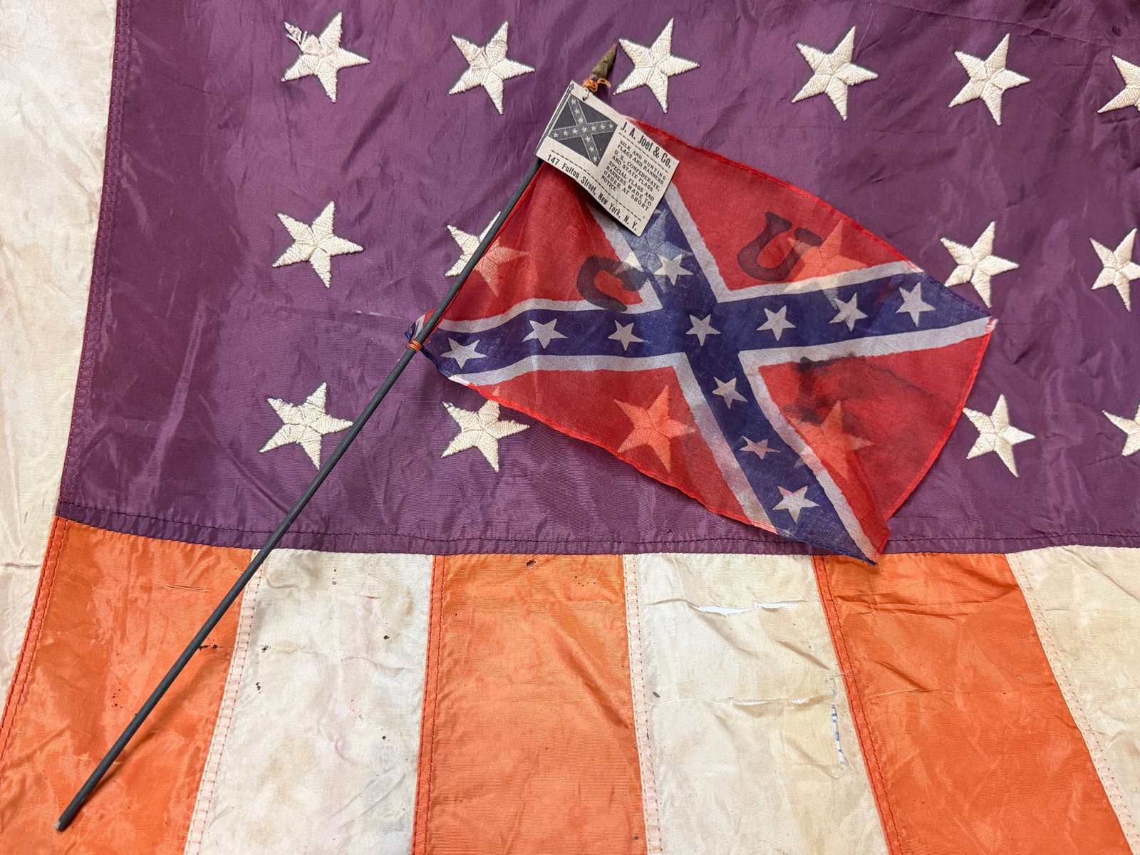 RARE CIVIL WAR CONFEDERATE CSA UCV SILK HAND FLAG BY J.A. JOEL & CO.: RARE CIVIL WAR CONFEDERATE CSA UCV SILK HAND FLAG BY J.A. JOEL & CO. . A very rare find. Shows good wear and use with a beautiful overall patina. Has a great look to it with an excellent overall eye a
