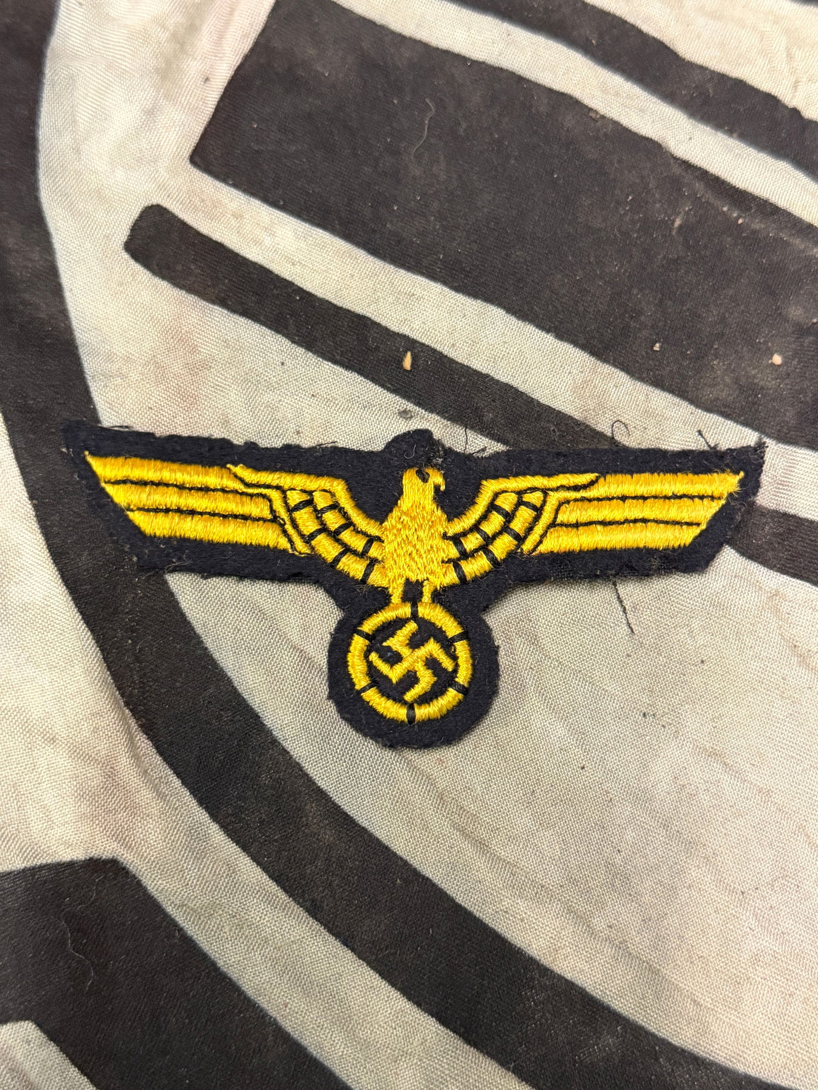 German WWII EM/NCO Naval Coastal Artillery Breast Eagle: German WWII EM/NCO Naval Coastal Artillery Breast Eagle. Machine embroidered national eagle in bright golden yellow threads on a cut-out dark green wool base. A rare find.