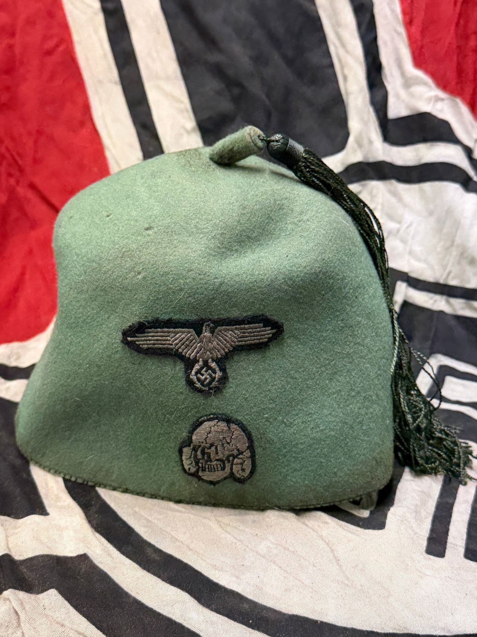 RARE WW2 GERMAN WAFFEN SS FEZ HAT, FIELD COMBAT FEZ CAP FOR FOREIGN VOLUNTEERS WITH RZM PAPER TAG: RARE WW2 GERMAN WAFFEN SS FEZ HAT, FIELD COMBAT FEZ CAP FOR FOREIGN VOLUNTEERS WITH RZM PAPER TAG. A very fine example of the field gray fez worn with the service uniform by the personnel of the 13th