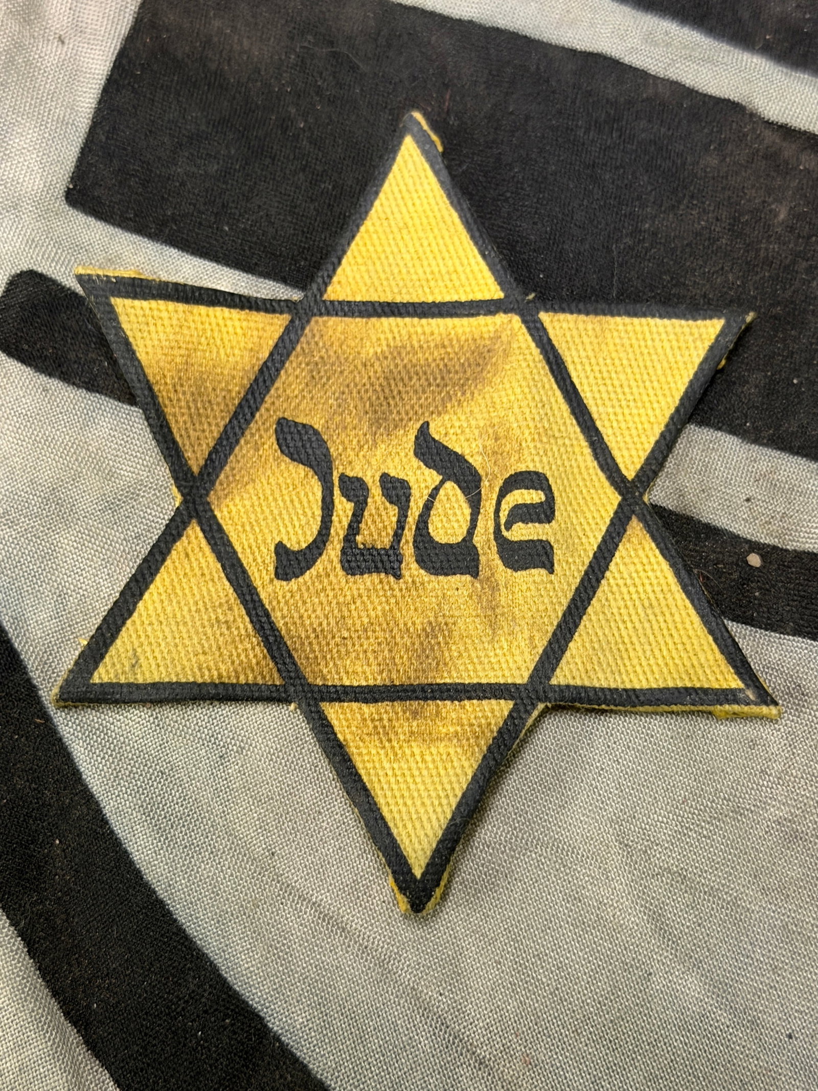 WW2 GERMAN JEWISH HOLOCAUST JUDE VERSION CLOTH STAR OF DAVID: WW2 GERMAN JEWISH HOLOCAUST JUDE VERSION CLOTH STAR OF DAVID. Holocaust - Used JUDE version cloth Star of David. This star was the one used to identify the Jews within Germany during III Reich. German