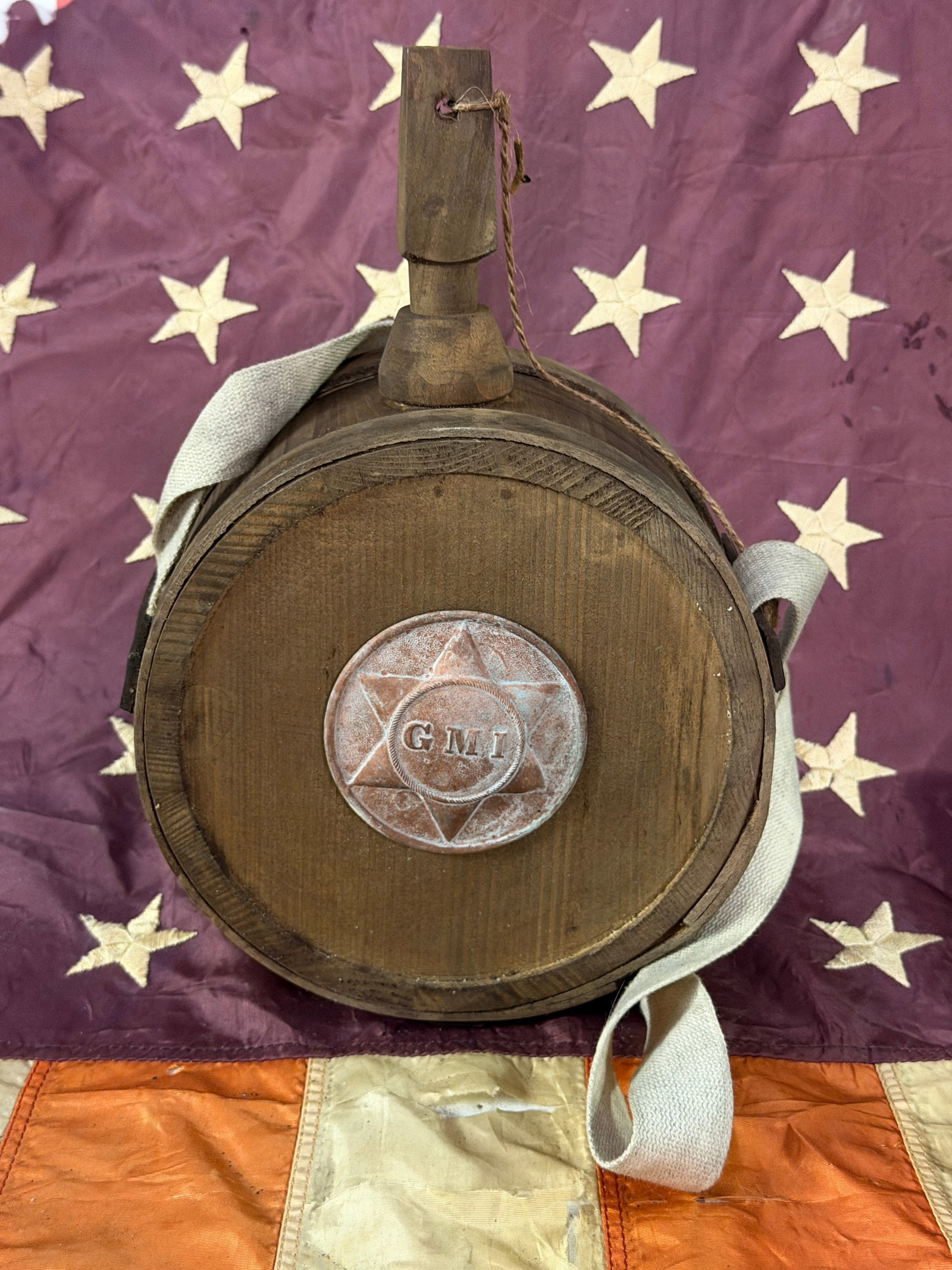 CIVIL WAR CONFEDERATE CSA GMI GEORGIA MILITARY INSTITUTE WOODEN CANTEEN WITH SLING: CIVIL WAR CONFEDERATE CSA GMI GEORGIA MILITARY INSTITUTE WOODEN CANTEEN WITH SLING. A VERY RARE FIND. SHOWS GOOD WEAR AND USE WITH A BEAUTIFUL OVERALL PATINA. HAS A GREAT LOOK TO IT WITH AN EXCELLENT 