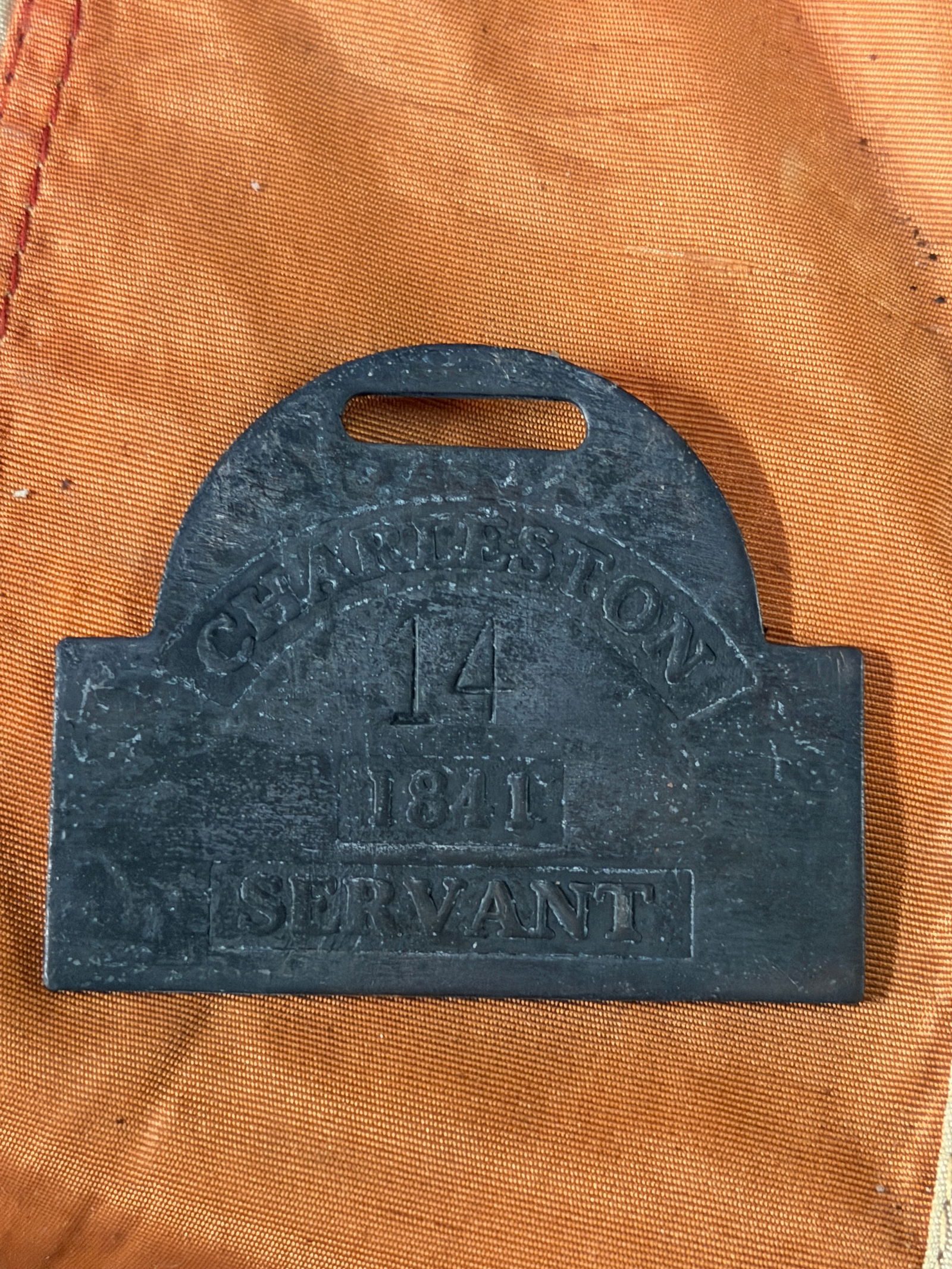 DATED 1841 CHARLESTON #14 SLAVE TAG SERVANT ID: DATED 1841 CHARLESTON #14 SLAVE TAG SERVANT ID. A RARE FIND. SHOWS GOOD WEAR AND USE WITH A BEAUTIFUL OVERALL PATINA. PLEASE VIEW ALL DETAILED PICTURES. A RARE EXAMPLE.