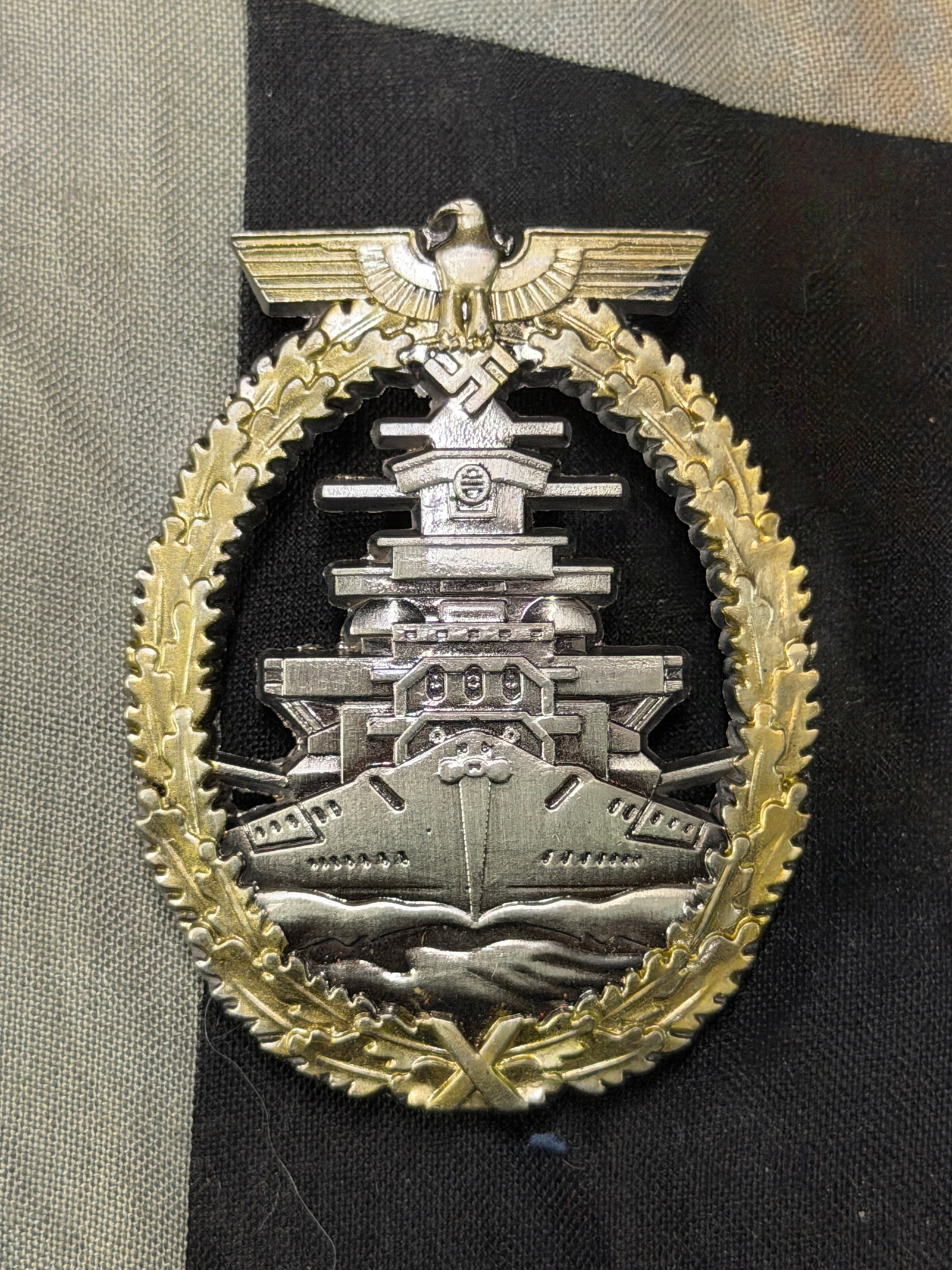 WW2 GERMAN KRIEGSMARINE HIGH SEAS FLEET BADGE BY FEC. ADOLF BOCK AUSF SCHWERIN BERLIN: WW2 GERMAN KRIEGSMARINE HIGH SEAS FLEET BADGE BY FEC. ADOLF BOCK AUSF SCHWERIN BERLIN. A VERY RARE EXAMPLE THAT IS IN MINT OVERALL SHAPE AND CONDITION WITH A BEAUTIFUL OVERALL PATINA. SHOWS GOOD WEAR 