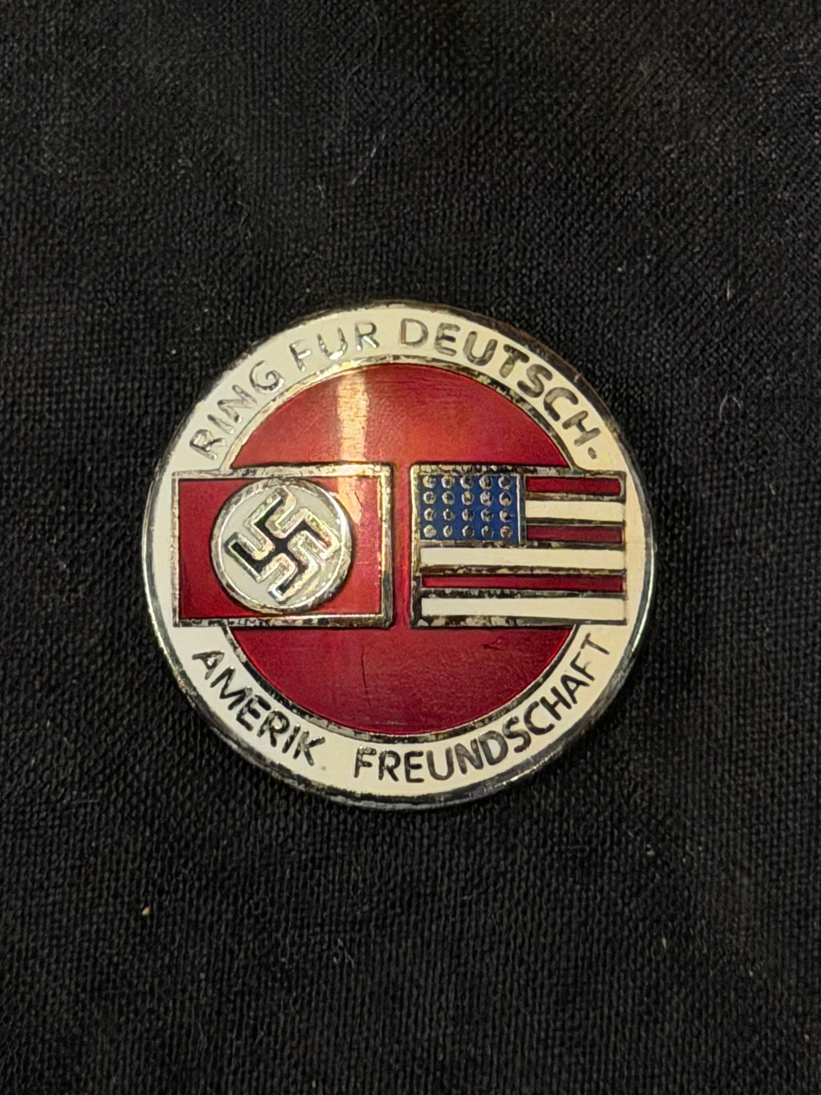WW2 GERMAN AND U.S. FRIENDSHIP ENAMELED LAPEL PIN BADGE BY RZM M1/129: WW2 GERMAN AND U.S. FRIENDSHIP ENAMELED LAPEL PIN BADGE BY RZM M1/129. A RARE FIND. SHOWS GOOD WEAR AND USE WITH A BEAUTIFUL OVERALL PATINA. PLEASE VIEW ALL DETAILED PICTURES. A SCARCE EXAMPLE.