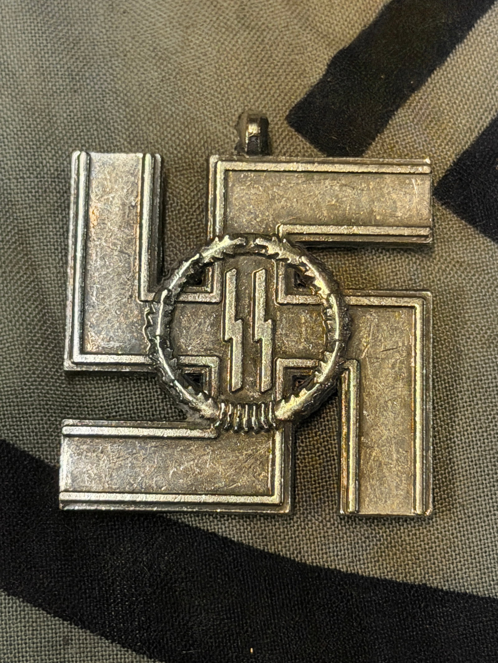 WW2 German 12 Year SS Long Service Award - Missing Ribbon: WW2 German 12 Year SS Long Service Award - Missing Ribbon. Shows good wear and use with a beautiful overall patina. Missing the ribbon on the medal. Please view all detailed pictures. A rare example o