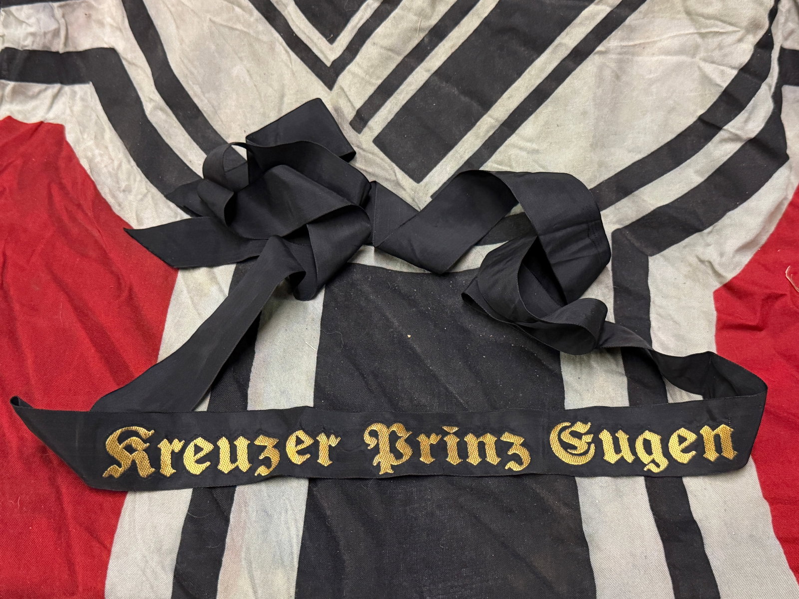 WW2 GERMAN KREUZER PRINZ EUGEN FULL LENGTH CAP TALLY: WW2 GERMAN KREUZER PRINZ EUGEN FULL LENGTH CAP TALLY. A VERY RARE FIND THAT IS IN MINT OVERALL SHAPE AND CONDITION WITH A BEAUTIFUL OVERALL PATINA. SHOWS GOOD WEAR AND USE. PLEASE VIEW ALL DETAILED PI