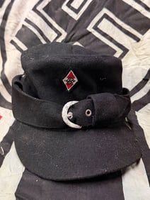 A WW2 German Third Reich black cloth peaked field cap of the Hitler Youth