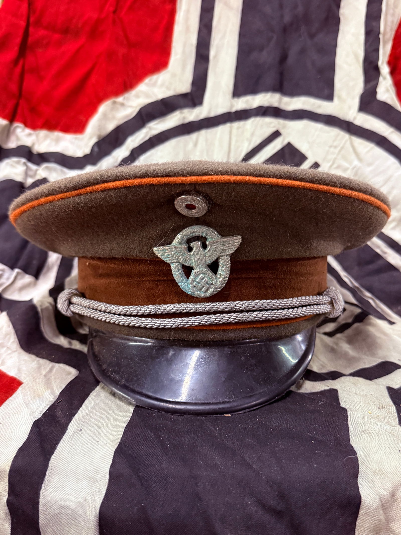 German WWII Police NCO Officer Visor Cap By Erel: German WWII Police NCO Officer Visor Cap By Erel. Well maker marked on the leather sweat band and the inside liner. This cap is constructed of "whipcord woven" wool fabric with a traditional high fron