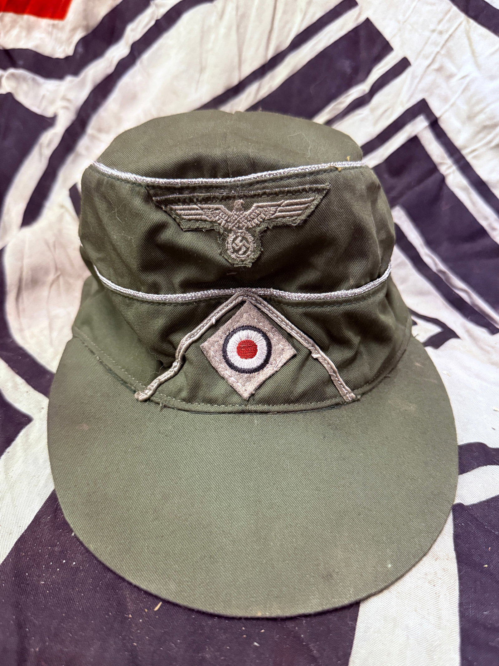WW2 German officer's M43 Field Cap - DAK / Deutsche Afrika Korps - Maker Marked: WW2 German officer's M43 Field Cap - DAK / Deutsche Afrika Korps - Maker Marked. A very rare example that is in mint overall shape and condition with a beautiful overall patina. Cap used by DAK soldie