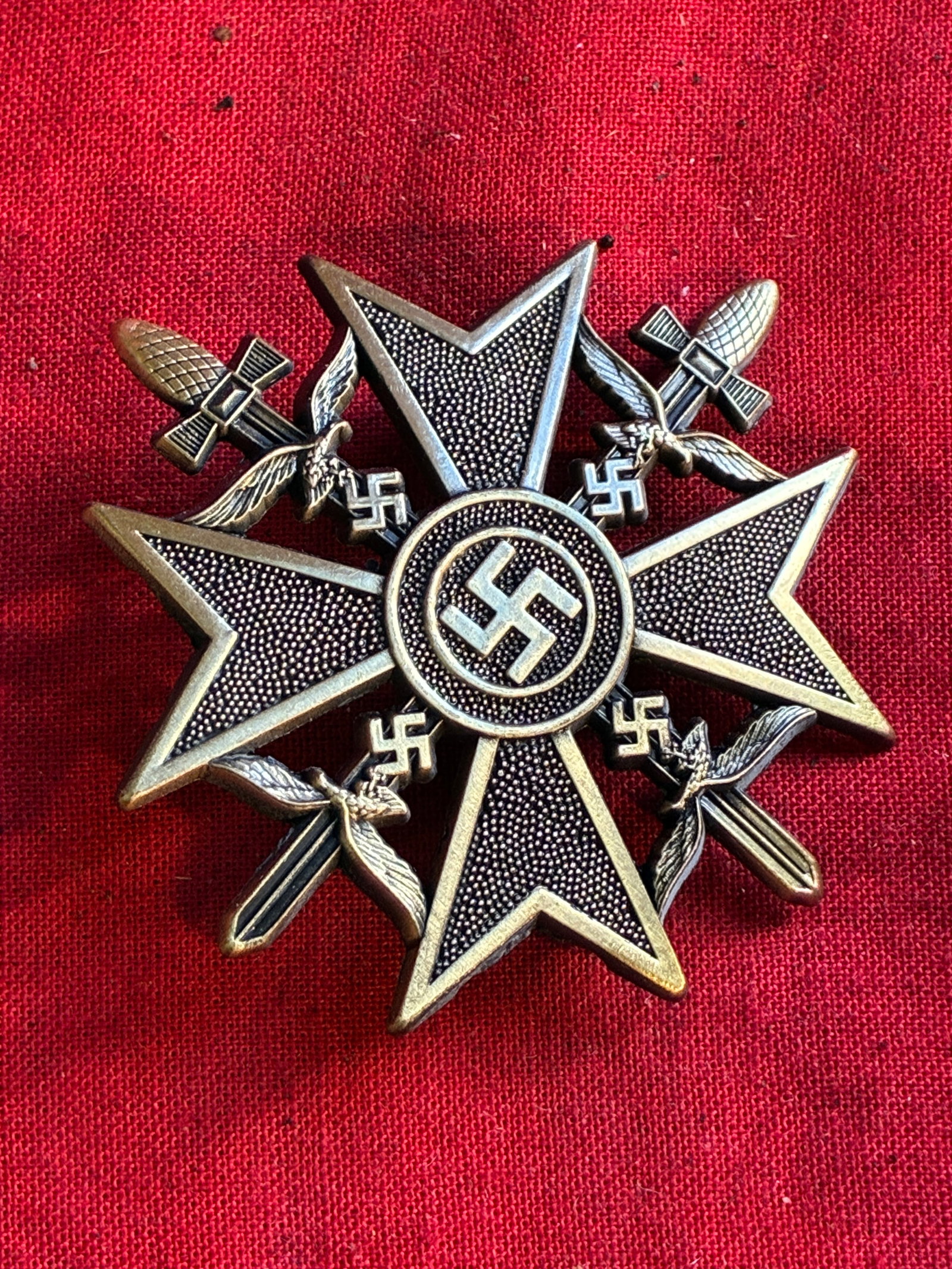 WWII GERMAN 3RD REICH SPANISH CROSS BADGE W SWORDS: WWII GERMAN 3RD REICH SPANISH CROSS BADGE W SWORDS. A RARE FIND. SHOWS GOOD WEAR AND USE WITH A BEAUTIFUL OVERALL PATINA. PLEASE VIEW ALL DETAILED PICTURES. A RARE EXAMPLE OF THE TIME PERIOD.