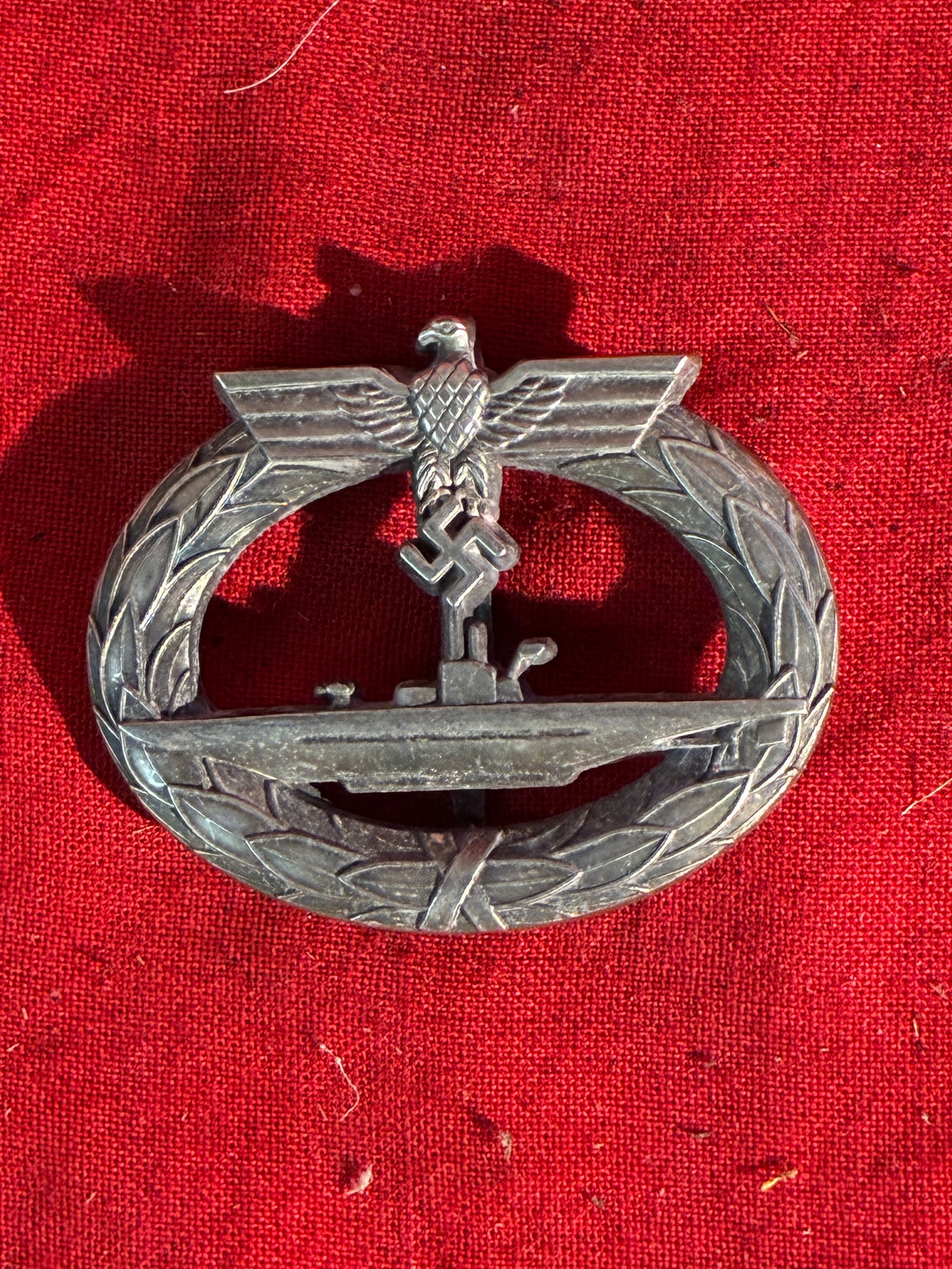 WW2 German U-Boot Kriegsabzeichen, 3rd Reich Badge By Schwerin Berlin 68: WW2 German U-Boot Kriegsabzeichen, 3rd Reich Badge By Schwerin Berlin 68. A very rare find. Shows good wear and use with a beautiful overall patina. Maker marked on the reverse. Please view all detail