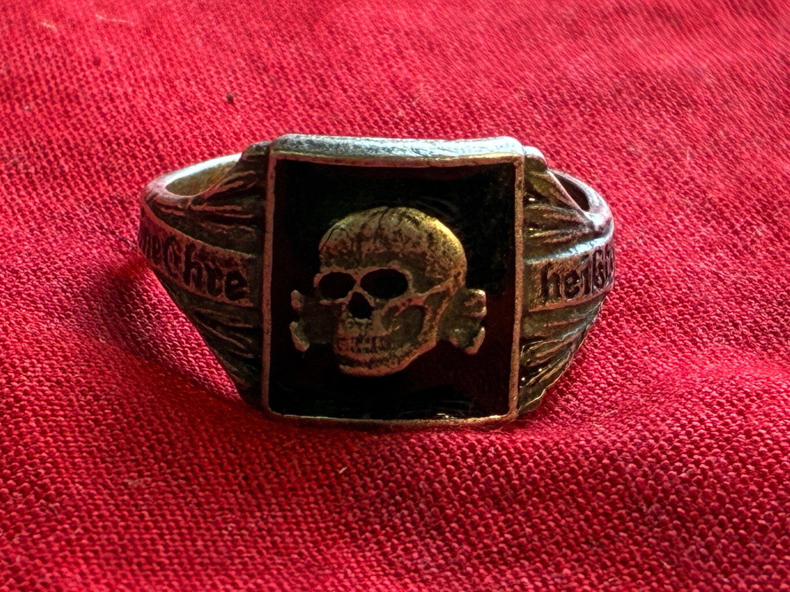 WW2 GERMAN TOTENKOPF SS 800 SILVER SKULL RING: WW2 GERMAN TOTENKOPF SS 800 SILVER SKULL RING. A VERY RARE FIND. SHOWS GOOD WEAR AND USE WITH A BEAUTIFUL OVERALL PATINA. PLEASE VIEW ALL DETAILED PICTURES. A SCARCE EXAMPLE OF THE TIME PERIOD.