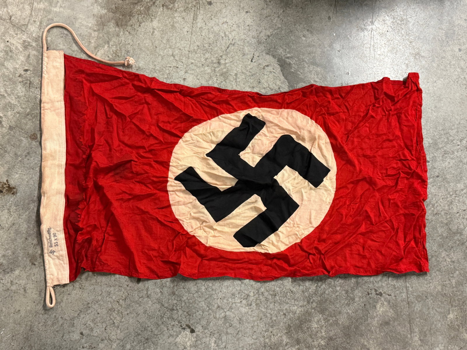 RARE WW2 GERMAN NATIONAL FLAG MAKER MARKED REICHSDFLG 55X90: RARE WW2 GERMAN NATIONAL FLAG MAKER MARKED REICHSDFLG 55X90. AN ULTRA RARE FIND THAT IS IN MINT OVERALL SHAPE AND CONDITION WITH A BEAUTIFUL OVERALL PATINA. SHOWS GOOD WEAR AND USE WITH A BEAUTIFUL PA
