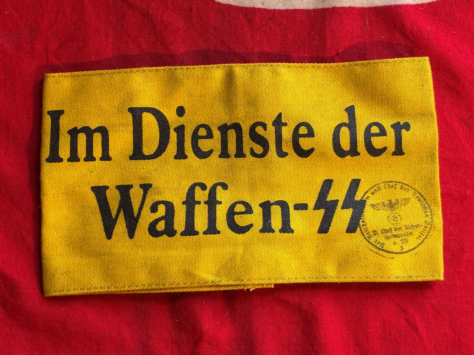 WW2 GERMAN IM DIENSTE DER WAFFEN SS ARMBAND WITH RZM PAPER TAG AND INSPECTION STAMP: WW2 GERMAN IM DIENSTE DER WAFFEN SS ARMBAND WITH RZM PAPER TAG AND INSPECTION STAMP. AN ULTRA RARE FIND THAT IS IN MINT OVERALL SHAPE AND CONDITION WITH A BEAUTIFUL OVERALL PATINA. PLEASE VIEW ALL DET