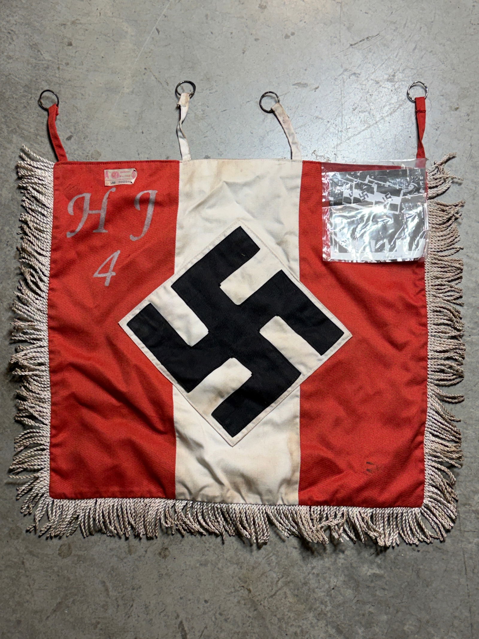 RARE WW2 GERMAN HITLER YOUTH DIVISION #4 TRUMPET BANNER FLAG - DOUBLE SIDED WITH RZM PAPER TAG: RARE WW2 GERMAN HITLER YOUTH DIVISION #4 TRUMPET BANNER FLAG - DOUBLE SIDED WITH RZM PAPER TAG. A VERY RARE EXAMPLE THAT IS IN MINT OVERALL SHAPE AND CONDITION WITH A BEAUTIFUL OVERALL PATINA. SHOWS G
