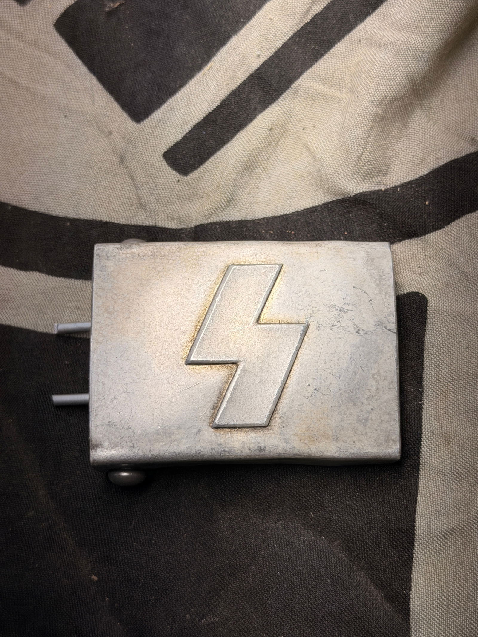 WW2 German Deutsches Jungvolk Aluminum Belt Buckle By RZM M34/2: WW2 German Deutsches Jungvolk Aluminum Belt Buckle By RZM M34/2. Shows good wear and use with a beautiful overall patina. Please view all detailed pictures. A rare example of the time period.